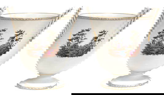 Pair of Richard Ginori Neoclassical Cachepots: A beautifully hand-decorated pair of porcelain cachepots by Richard Ginori, featuring neoclassical pastoral scenes. Each urn-shaped vessel is adorned with detailed vignettes of a man, donkey, and seat