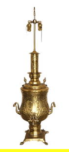 Vintage Brass Samovar Converted to Double-Socket Lamp – Ornate Middle Eastern/Russian Design: Striking and unique vintage brass samovar converted into an elegant double-socket table lamp. This beautifully repurposed piece features: Intricately embossed brass body, with foliate and bird-like sy
