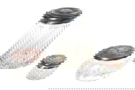Set of 3 Antique Cut Glass Vanity Jars – Sterling & Silverplate Lids (Gorham & Others): Lovely set of three antique vanity or dresser jars, each with pressed or cut glass bodies and ornate silver lids, including: One sterling silver floral repoussé lid, marked STERLING One silverplate l