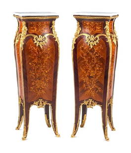 Pair of Louis XV Style Marquetry Pedestals with Gilt Bronze Mounts and Marble Tops: Exquisite pair of Louis XV style pedestals featuring fine marquetry inlays on serpentine-form bodies, adorned with intricate floral motifs. Each pedestal is embellished with richly detailed gilt bronz