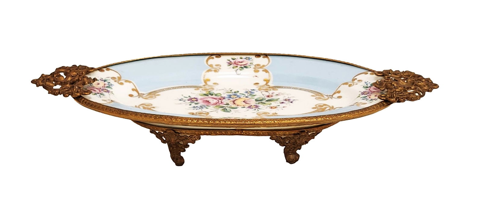 Limoges Porcelain Oval Centerpiece with Gilt Bronze Mounts, Hand-Painted Floral Design: Elegant Limoges porcelain oval centerpiece featuring a delicate hand-painted floral bouquet with roses and forget-me-nots framed by gilt scrollwork over a soft blue and white ground. The dish is mount
