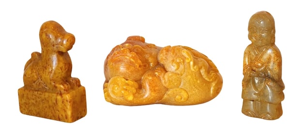 Set of three Chinese hand-carved stone figures, including: