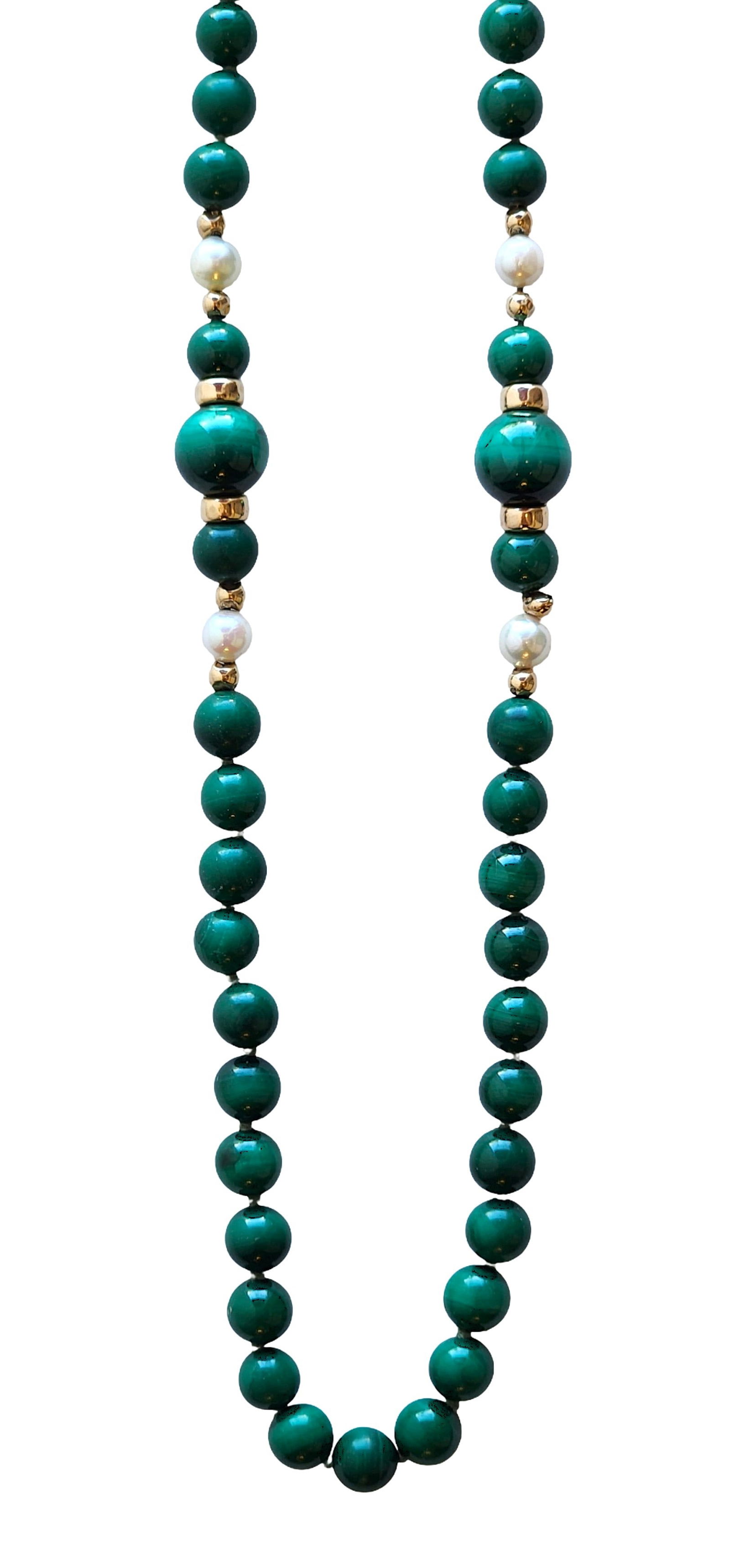 Vintage Malachite Bead Necklace with Freshwater Pearls & Gold-Tone Accents: This elegant vintage necklace features richly polished malachite beads in deep, vibrant green tones accented with freshwater pearl stations and gold-tone spacer beads. The natural banding of the malac
