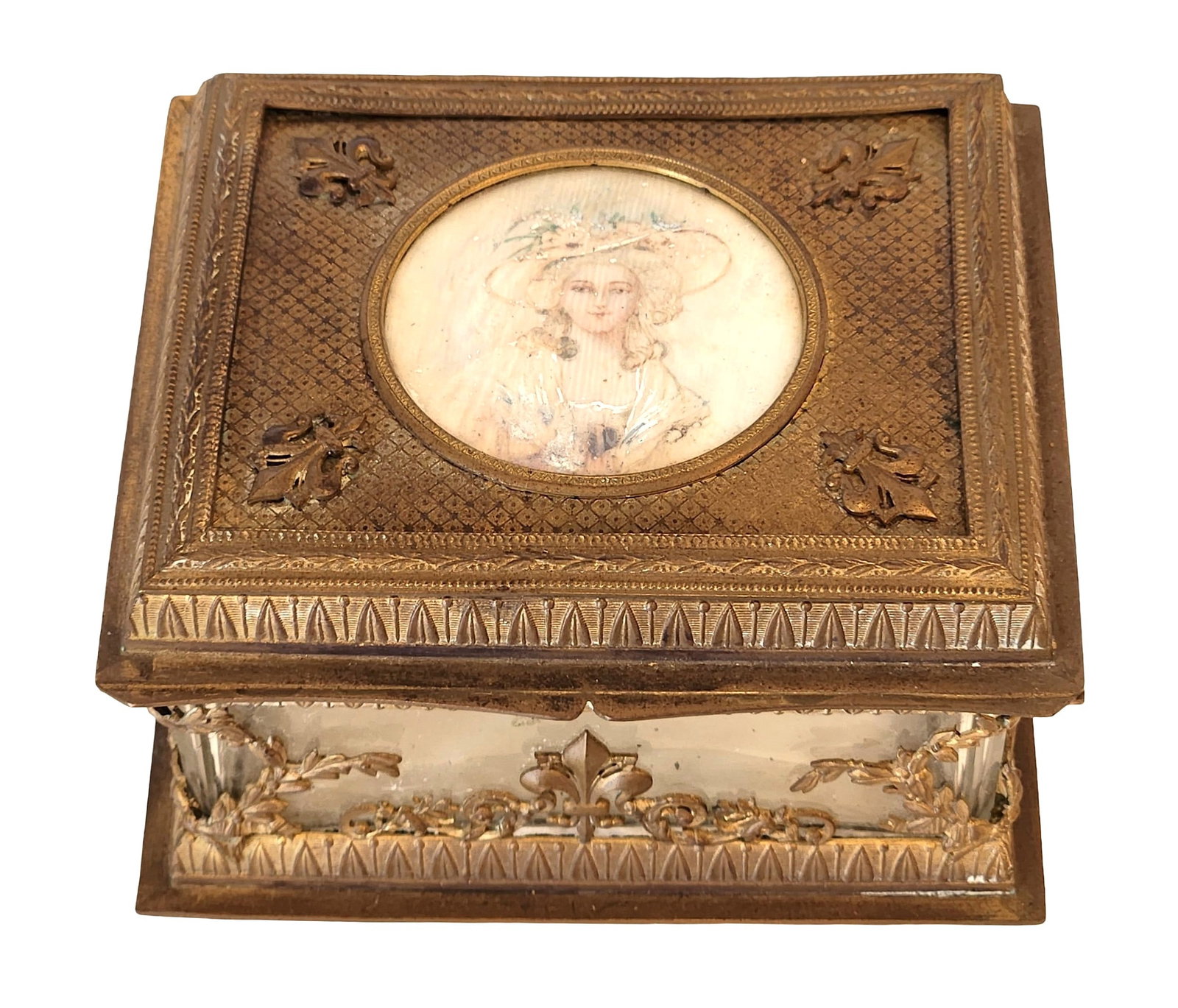 19th Century French Gilt Bronze and Glass Jewelry Casket with Portrait Miniature: Elegant 19th-century French gilt bronze and beveled glass jewelry casket, the hinged lid featuring a finely painted portrait miniature of a lady in a straw hat surrounded by ornate engine-turned and f