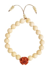 Beaded Bracelet with Carved Floral Centerpiece