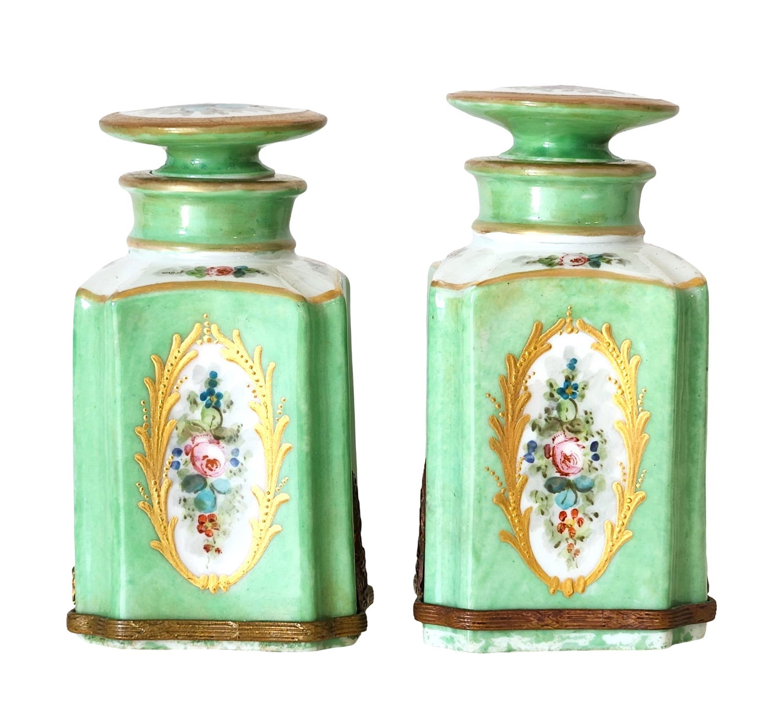 Pair of 19th C. French Sevres Porcelain Perfume Bottles – Hand-Painted Floral: Elegant pair of antique French porcelain perfume or apothecary bottles, finely hand-painted with floral medallions framed in gilt cartouches. The bodies are glazed in a vibrant celadon green with deta