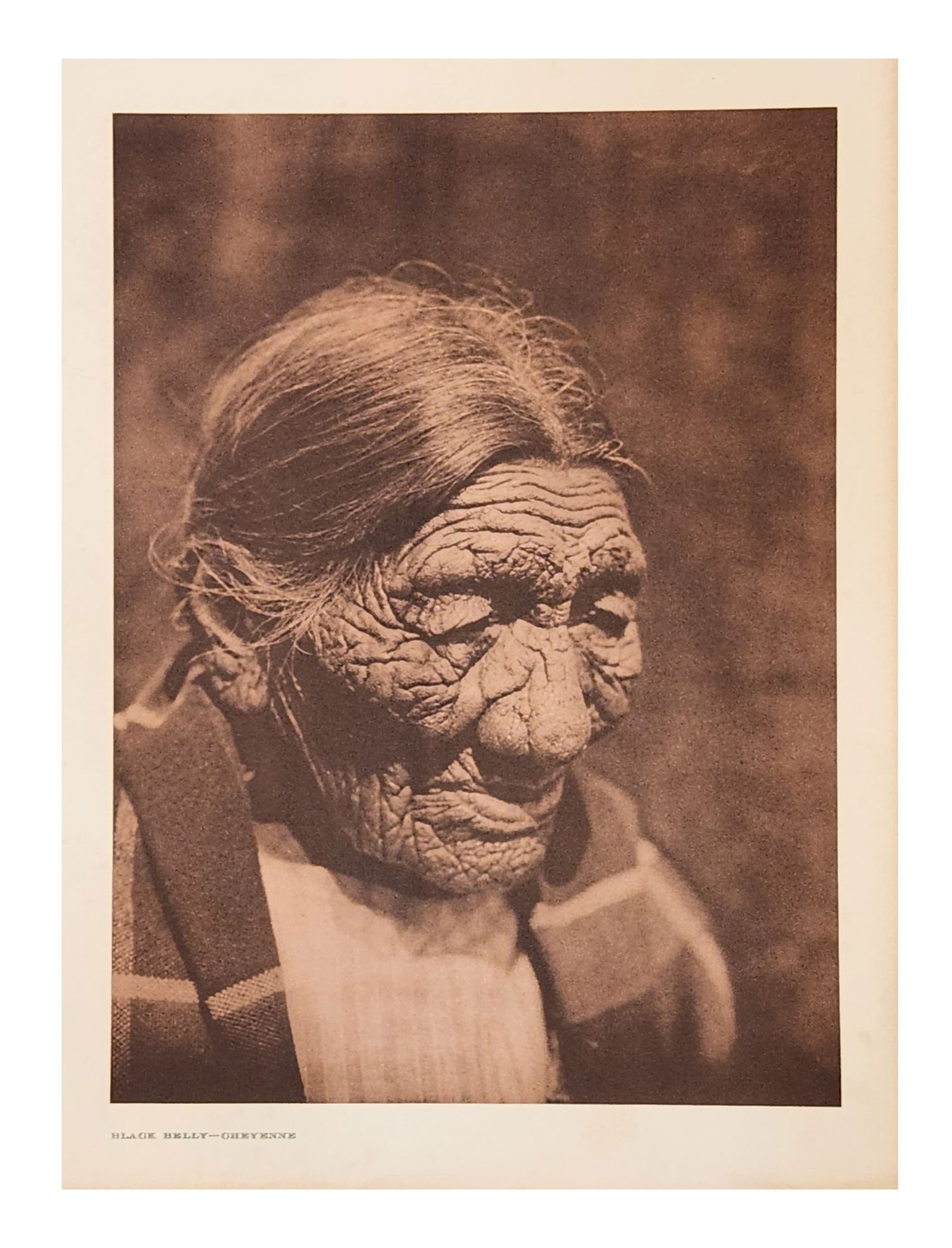 Edward Sheriff Curtis (1868 - 1952) American: Edward Sheriff Curtis (1868 - 1952) American Title: Black Belly - Cheyenne Print Caption Date: 1927 Measure 18"in H x 13"in W no framed The extreme age of this Cheyenne is
