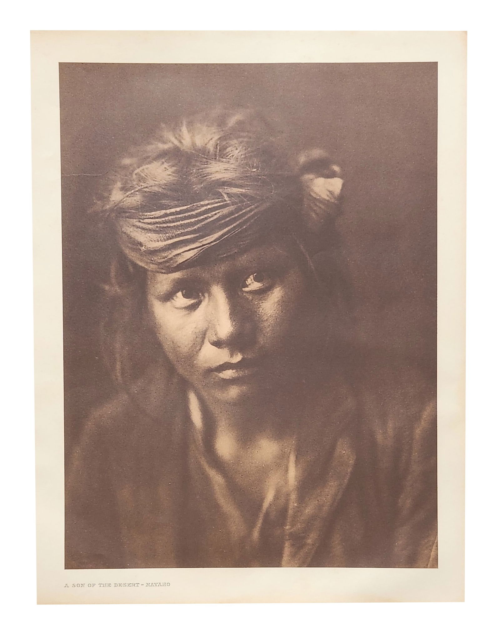 Edward Sheriff Curtis (1868 - 1952) American: Edward Sheriff Curtis (1868 - 1952) American Title: A Son of the Desert - Navaho Print Caption - Engraving Dated: 1904 Measure 18"in H x 13"in W no framed In the early morn