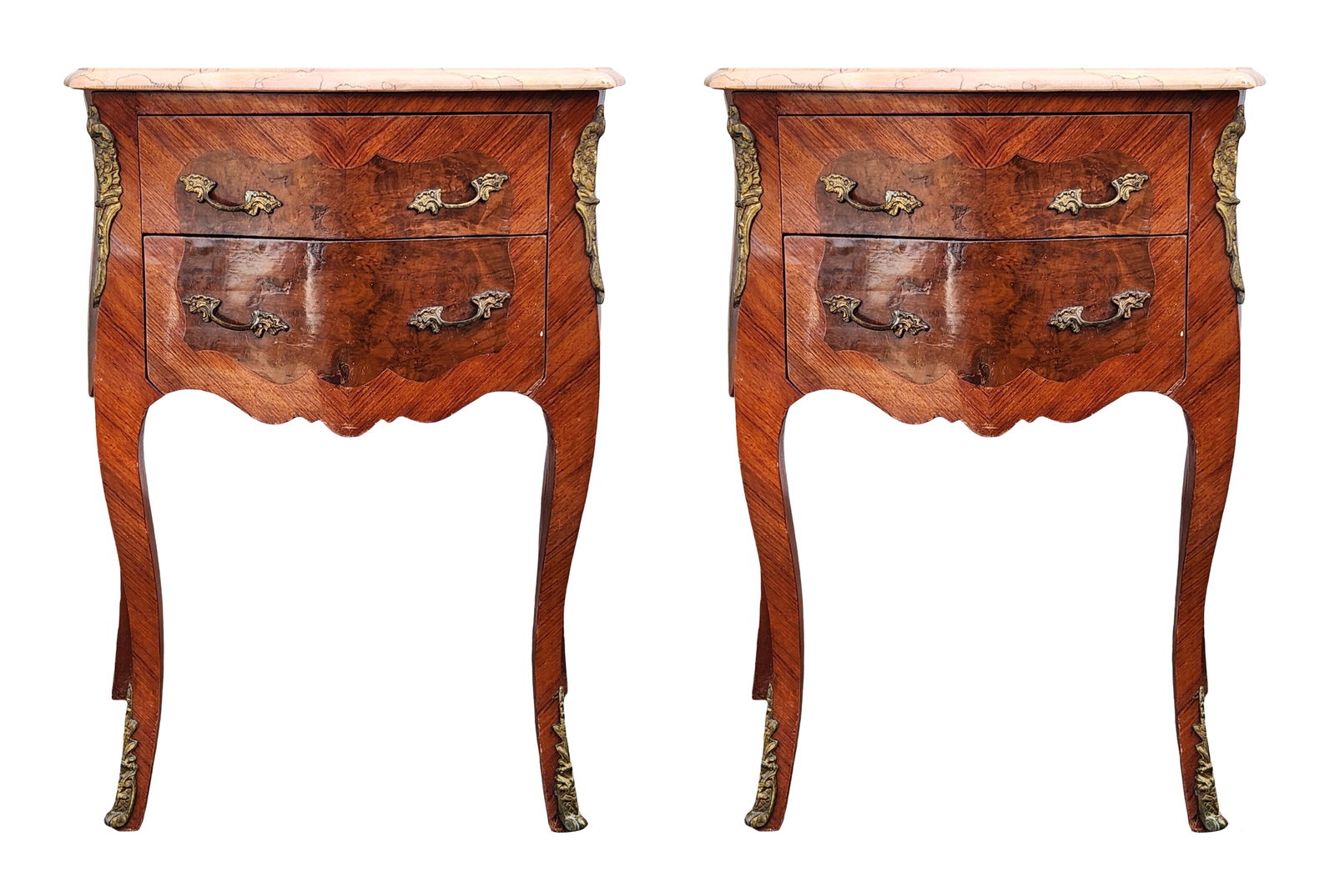 Pair of French Louis XV Style Inlaid Commodes w/ Marble Tops & Ormolu Mounts: Matching pair of Louis XV–style two-drawer commodes, each topped with a shaped pink marble slab and decorated with inlaid veneers, serpentine fronts, and ornate ormolu bronze mounts. The commodes fe