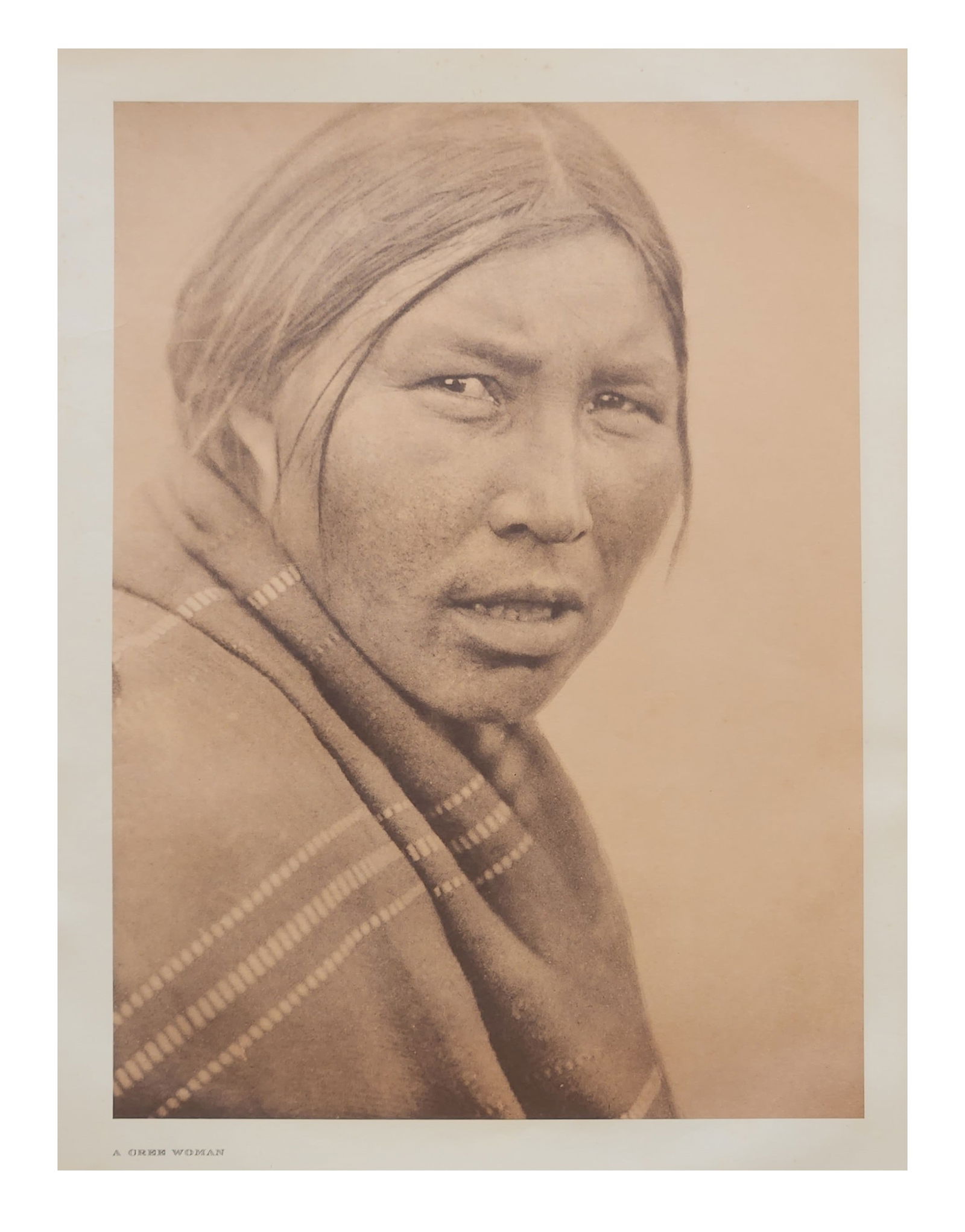 Edward Sheriff Curtis (1868 - 1952) American: Edward Sheriff Curtis (1868 - 1952) American Title: A Cree Woman Print Caption - Engraving Date: 1926 Measure 18"in H x 13"in W no framed