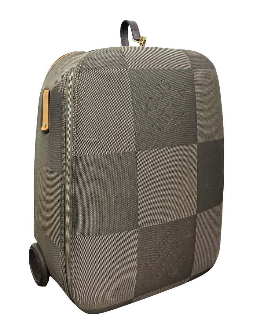 100% Original Louis Vuitton Pegase 65 Rolling Suitcase, Damier Geant Canvas, Made in France: Elegant Louis Vuitton Pegase 65 rolling suitcase, crafted in Damier Geant canvas with leather trim and silver-tone hardware. The piece features a zip-around closure, telescopic handle, dual wheels mar