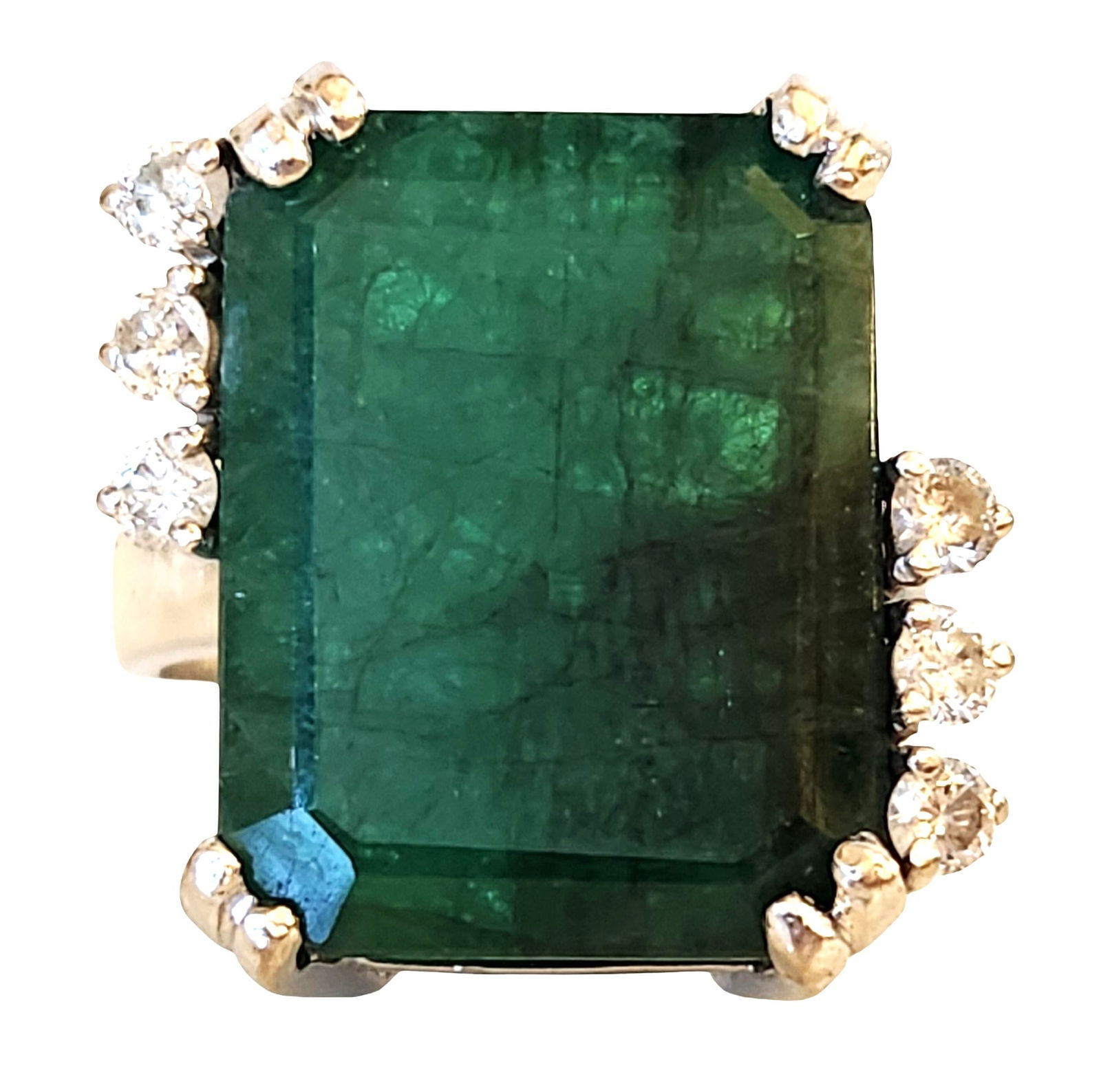 15ct Natural Brazilian Emerald & Diamond Ring in 14K White Gold – Size 8.75: A striking 15-carat natural Brazilian emerald set in solid 14K white gold, accented by six sparkling round-cut diamonds. The emerald is cut in an elongated rectangular/emerald shape, showcasing deep g