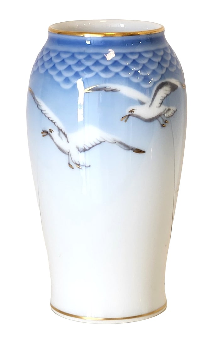 Royal Copenhagen Porcelain Vase with Flying Seagulls, Denmark: Elegant porcelain vase by Royal Copenhagen, Denmark, decorated with flying seagulls against a soft blue-to-white graduated ground. The upper portion features a molded scale pattern beneath the rim, ac