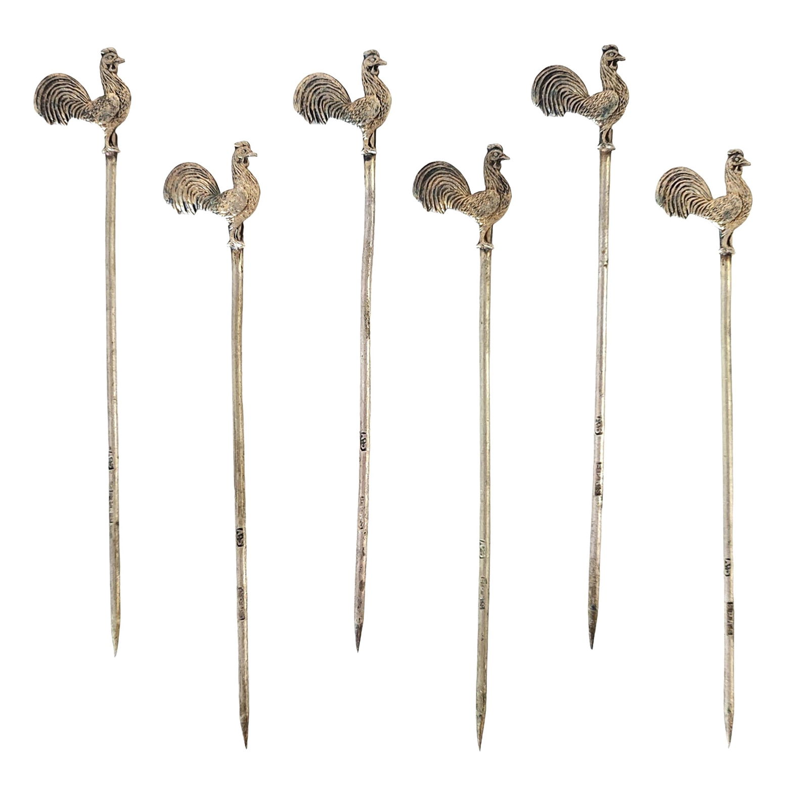 Set of Six English Silverplate Rooster Cocktail Picks, Mid-20th Century: Set of six silverplate cocktail picks, each topped with a finely detailed rooster finial. Marked “Made in England” on the reverse. The roosters exhibit well-defined feathering and sculptural f