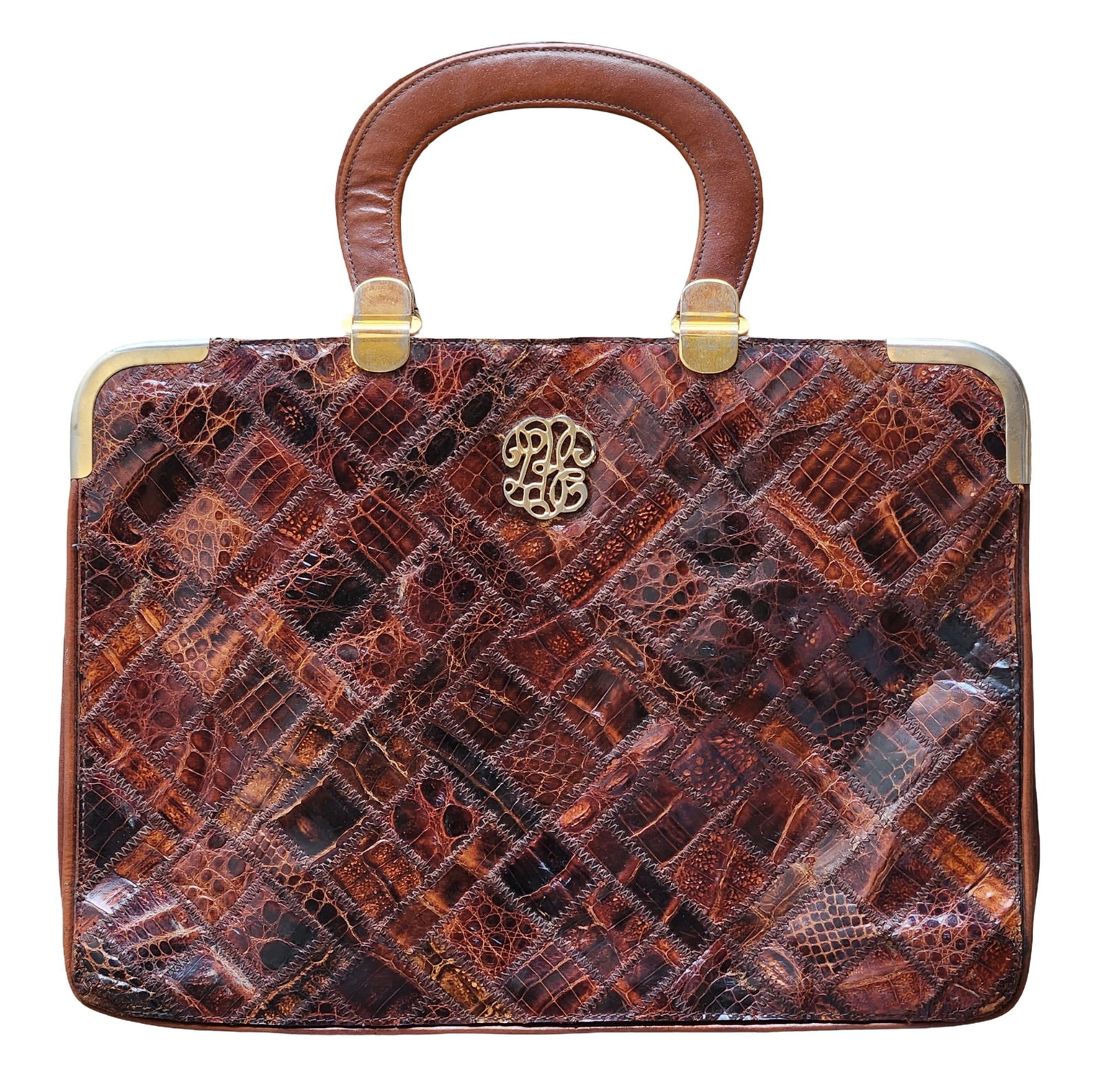 Vintage Faux Crocodile Leather Patchwork Handbag, 1960s–1970s: Elegant vintage handbag crafted in faux crocodile leather patchwork, dating from the 1960s–1970s. The exterior features a richly textured, geometric patchwork design in warm brown tones, showcasing