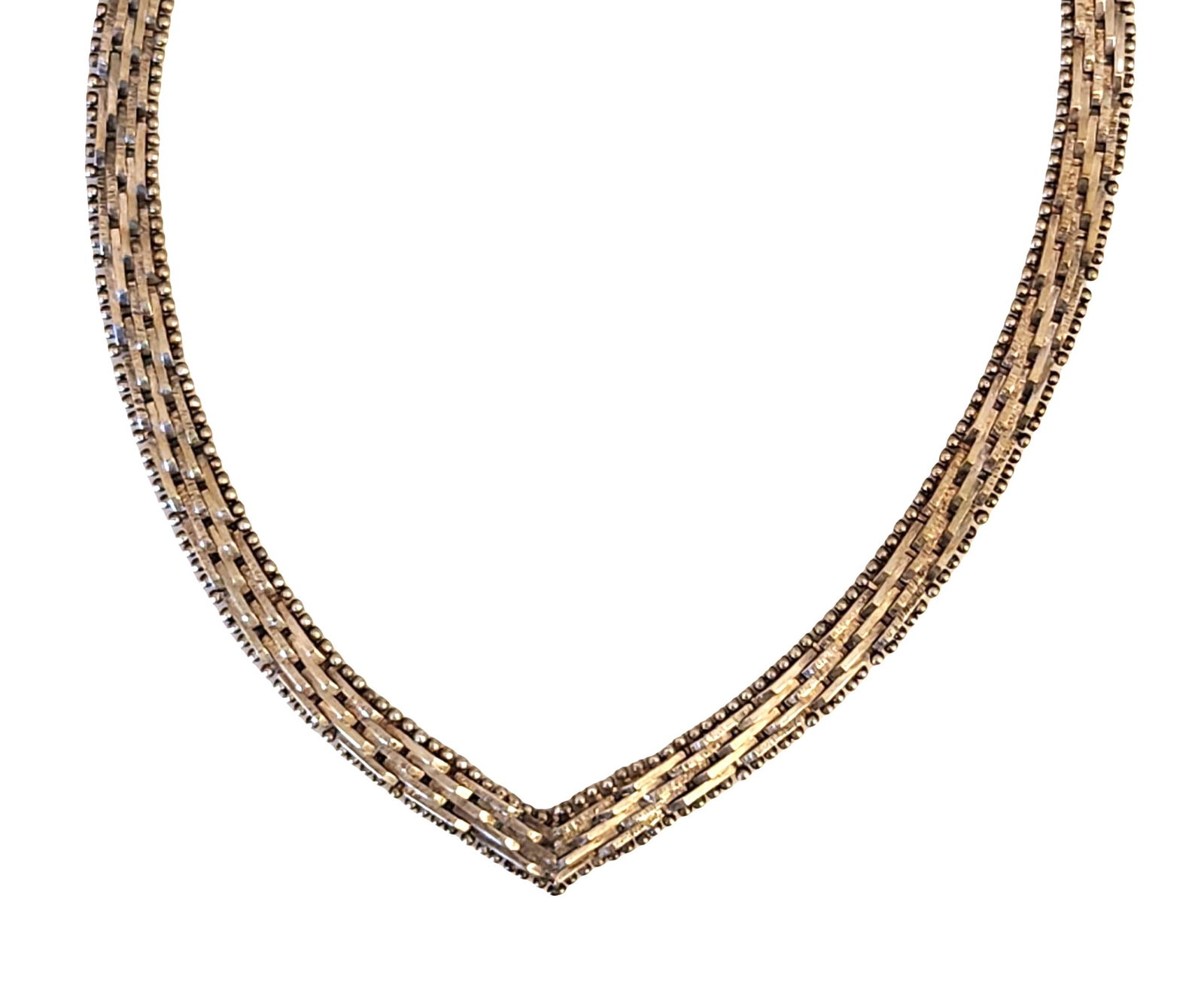 Italian Sterling Silver Multi-Strand Necklace: Sterling silver necklace composed of multiple fine articulated strands joined to form a flexible V-shaped silhouette. The strands combine smooth bar links and beaded elements, creating a layered textu