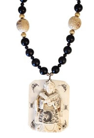 Carved Figural Pendant Necklace with Black Beads and Decorative Accents