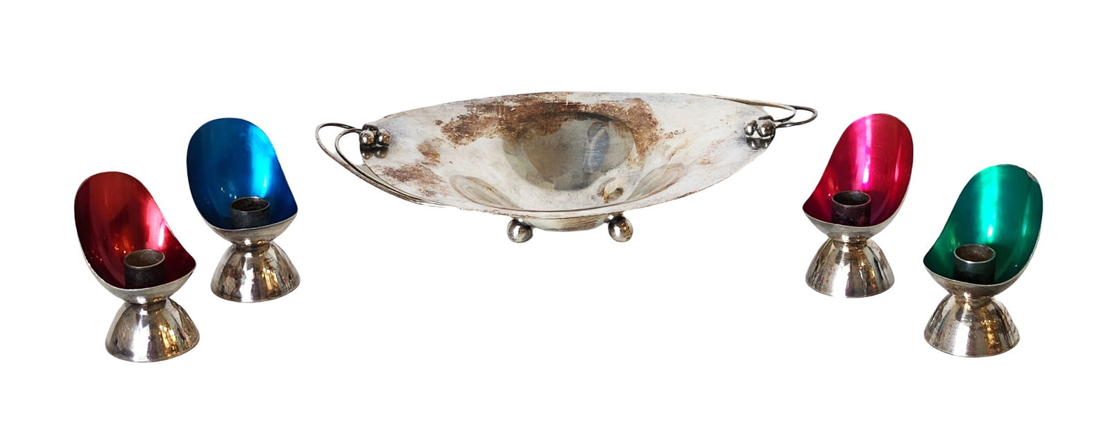 Holland Silverplate and Enamel Set with Bowl and Four Candlesticks, Marked J.VZ 90: Mid-century modern silverplate and enamel set from Holland, including one oval bowl on ball feet with side handles and four candlesticks with colorful enamel interiors in red, blue, and green. Marked
