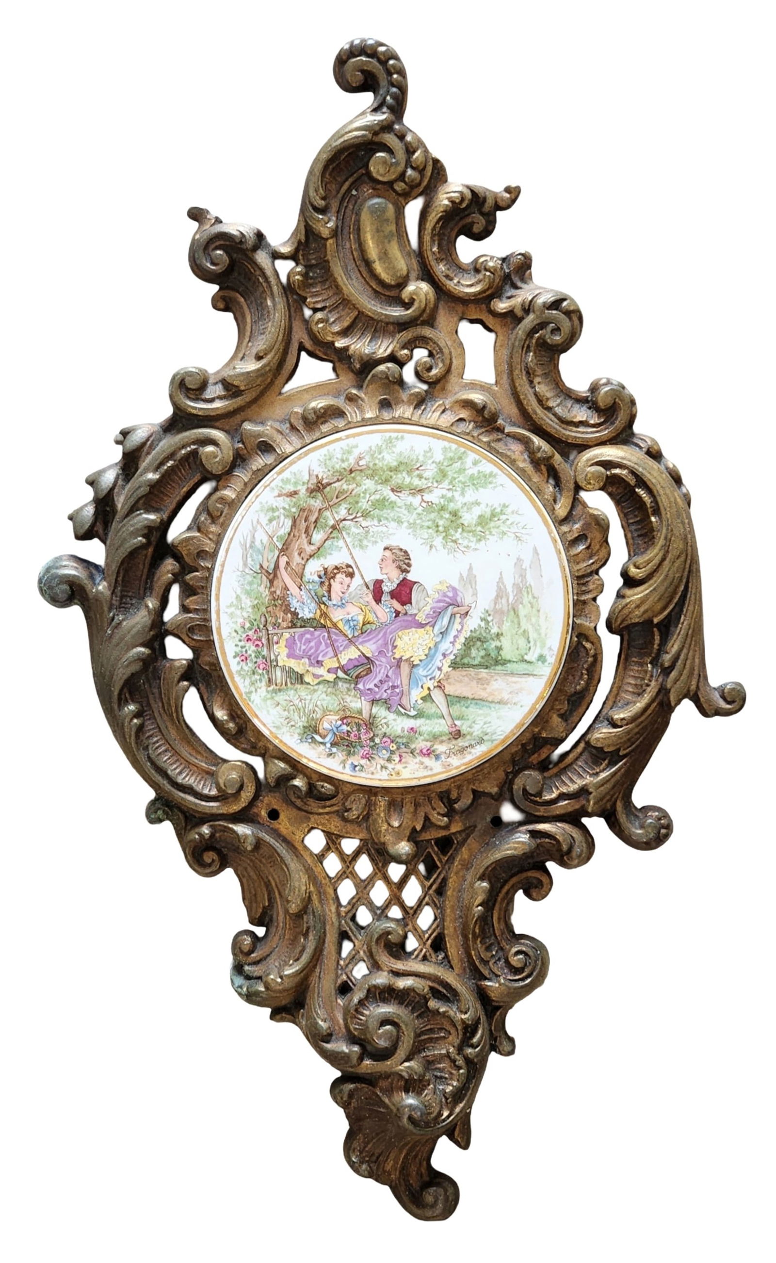 Rococo-Style Gilt Metal Wall Plaque with Fragonard Porcelain Medallion: Decorative Rococo-style wall plaque featuring an ornate gilt metal frame surrounding a circular porcelain medallion. The porcelain depicts a romantic pastoral scene after Jean-Honoré Fragonard, showi