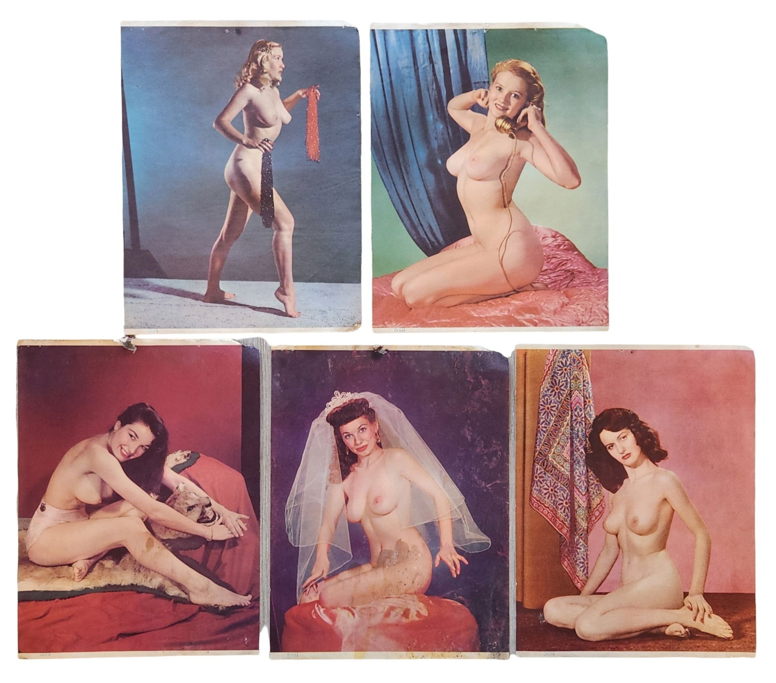 Group of Vintage Color Pin-Up Nude Photography Prints, Mid-20th Century: Group of vintage color pin-up photography prints depicting posed female nude figures in studio settings. The images reflect classic mid-20th-century glamour and pin-up photography, featuring composed
