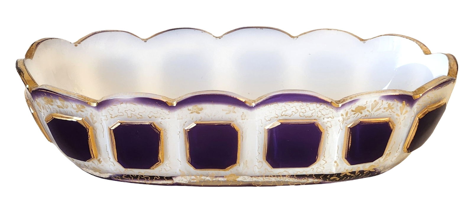 Bohemian Cased Glass Centerpiece Bowl with Gilt Decoration: Decorative Bohemian art glass centerpiece bowl featuring a white cased glass body accented with deep purple panels and rich gilt decoration. The bowl has a scalloped rim and elongated oval form, with