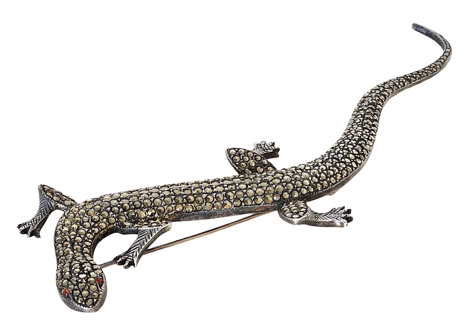 Vintage Sterling Silver Marcasite Lizard Brooch with Red Stone Eyes: Striking vintage sterling silver lizard brooch adorned with numerous sparkling marcasite stones that cover the body from head to tail. The piece features a gracefully curved tail and finely detailed l