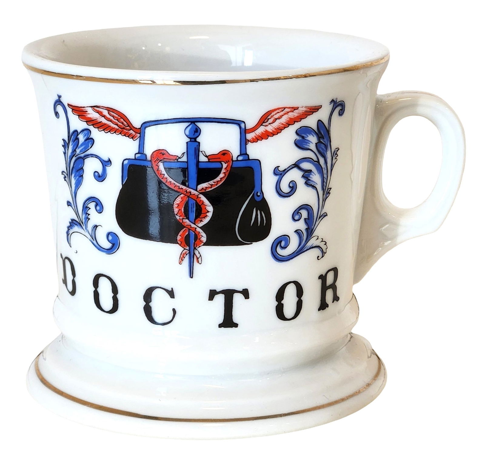 Vintage Doctor Occupational Mug – Medical Motif: Decorative ceramic mug featuring a Doctor / medical profession theme. The front is decorated with a stylized medical emblem incorporating a winged staff with a serpent (caduceus) above a traditional d