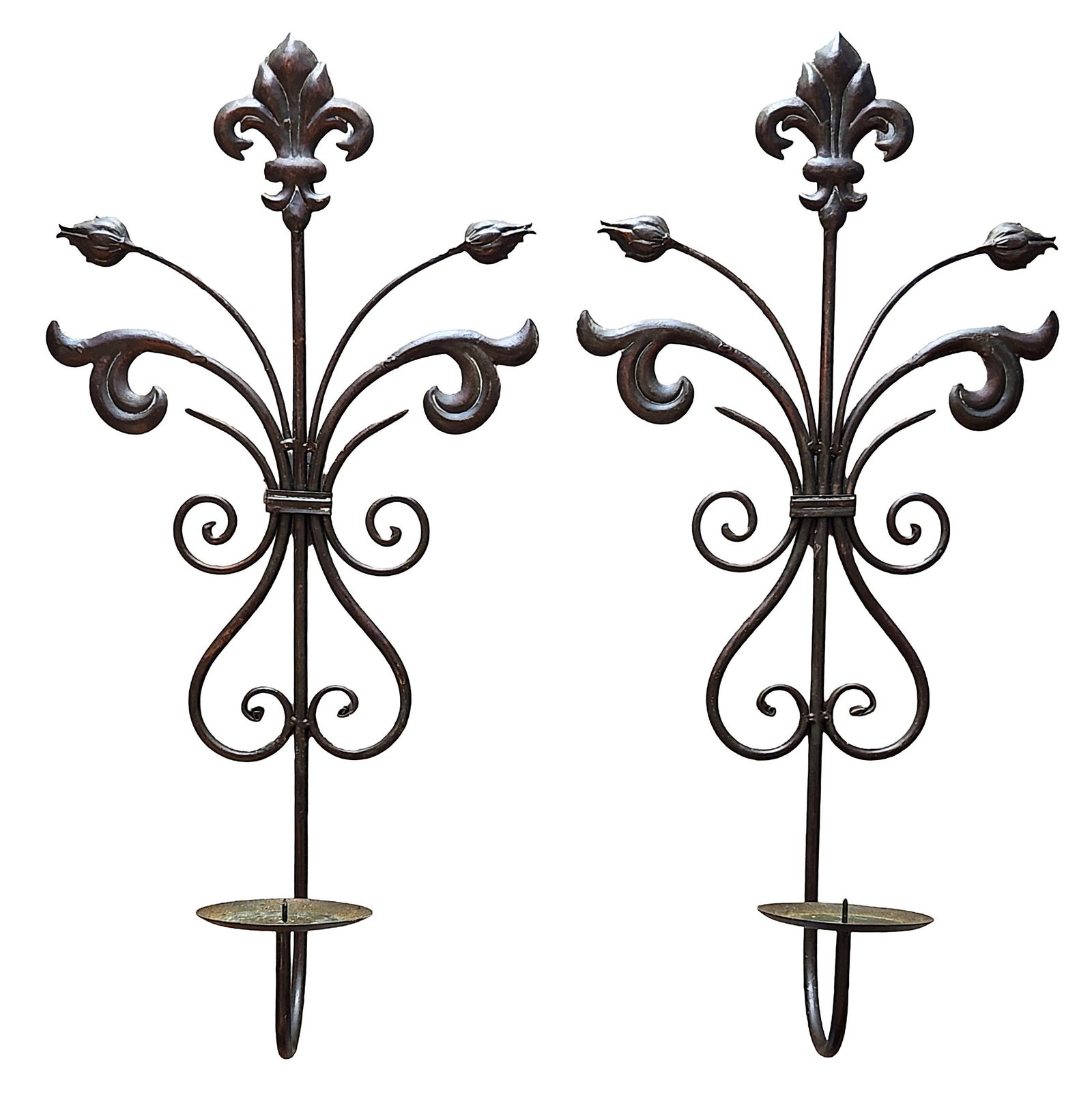Pair of Decorative Metal Wall Candle Sconces with Fleur-de-Lis Motif: Pair of decorative metal wall-mounted candle sconces featuring an elegant scrolling design. Each sconce is centered with a fleur-de-lis finial and stylized vine-like arms with leaf and bud details. A