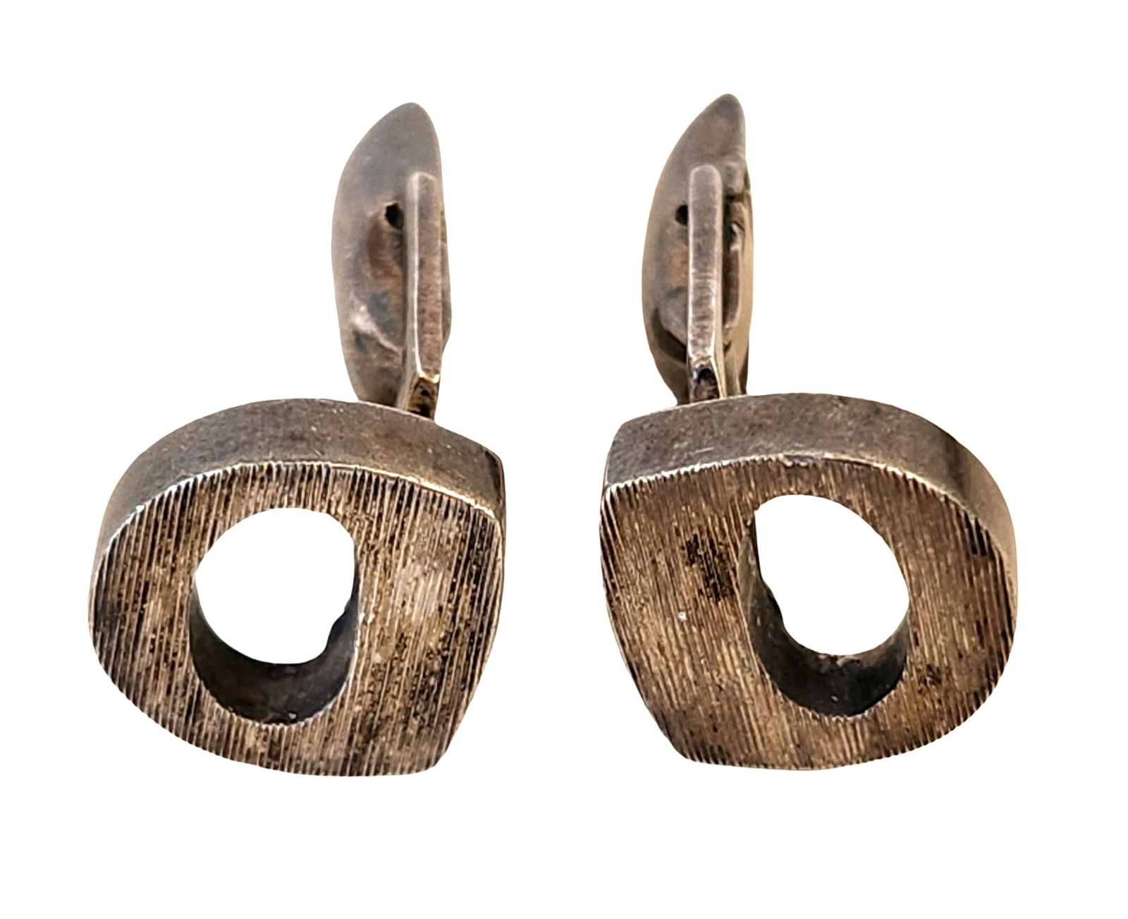 Tiffany Marked Sterling Silver Modernist Clip-On Earrings with Tiffany Pouch: Pair of sterling silver modernist earrings with an open geometric design. Each earring is marked “TIFFANY & CO. STERLING” on the reverse. Clip-on backs. Natural patina and surface wear consist