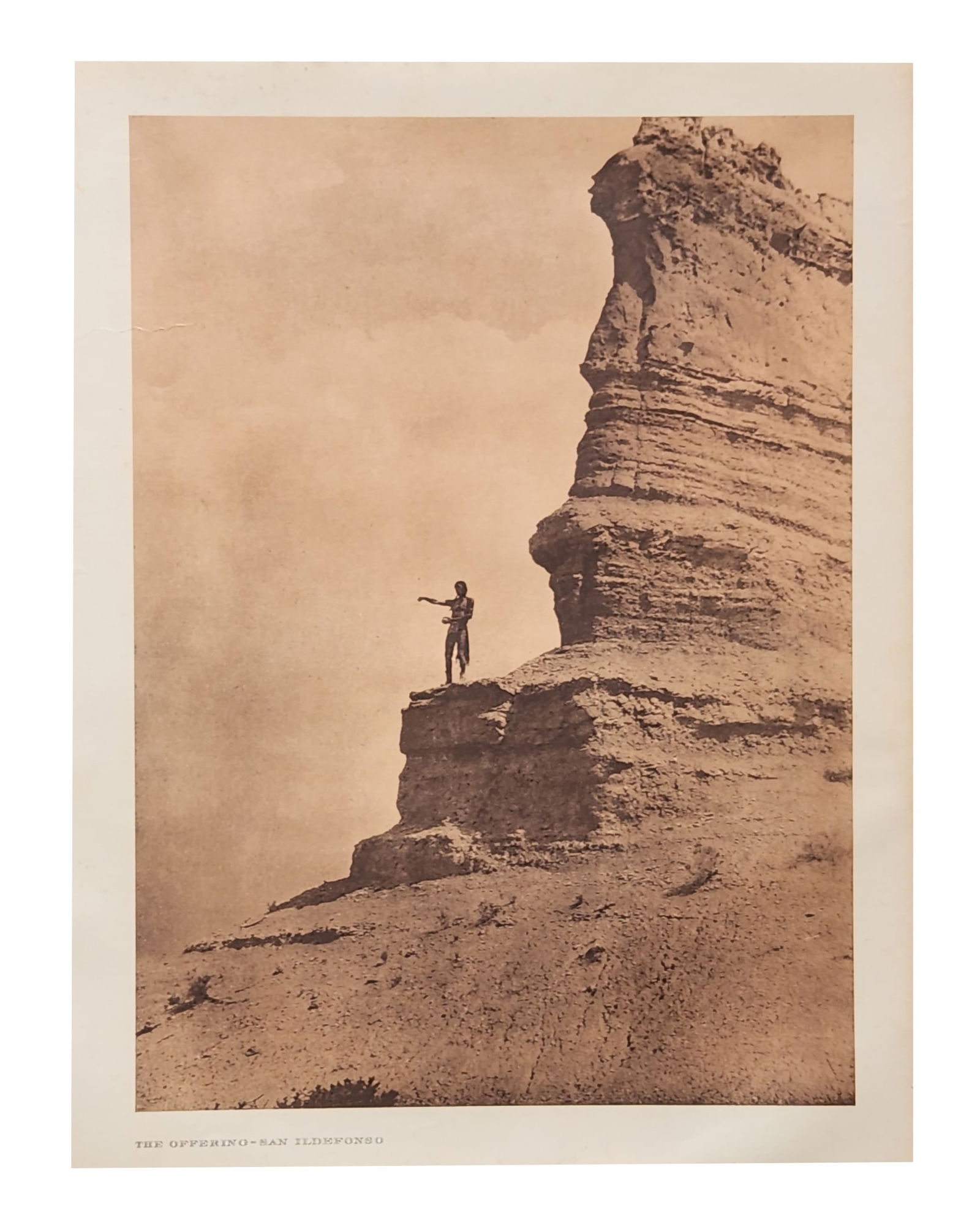 Edward Sheriff Curtis (1868 - 1952) American: Edward Sheriff Curtis (1868 - 1952) American Title: The Offering - San Ildefonso Print Caption - Engraving Date: 1925 Measure 13"in H x 18"in W no framed A pinch of cornmeal tossed into the a