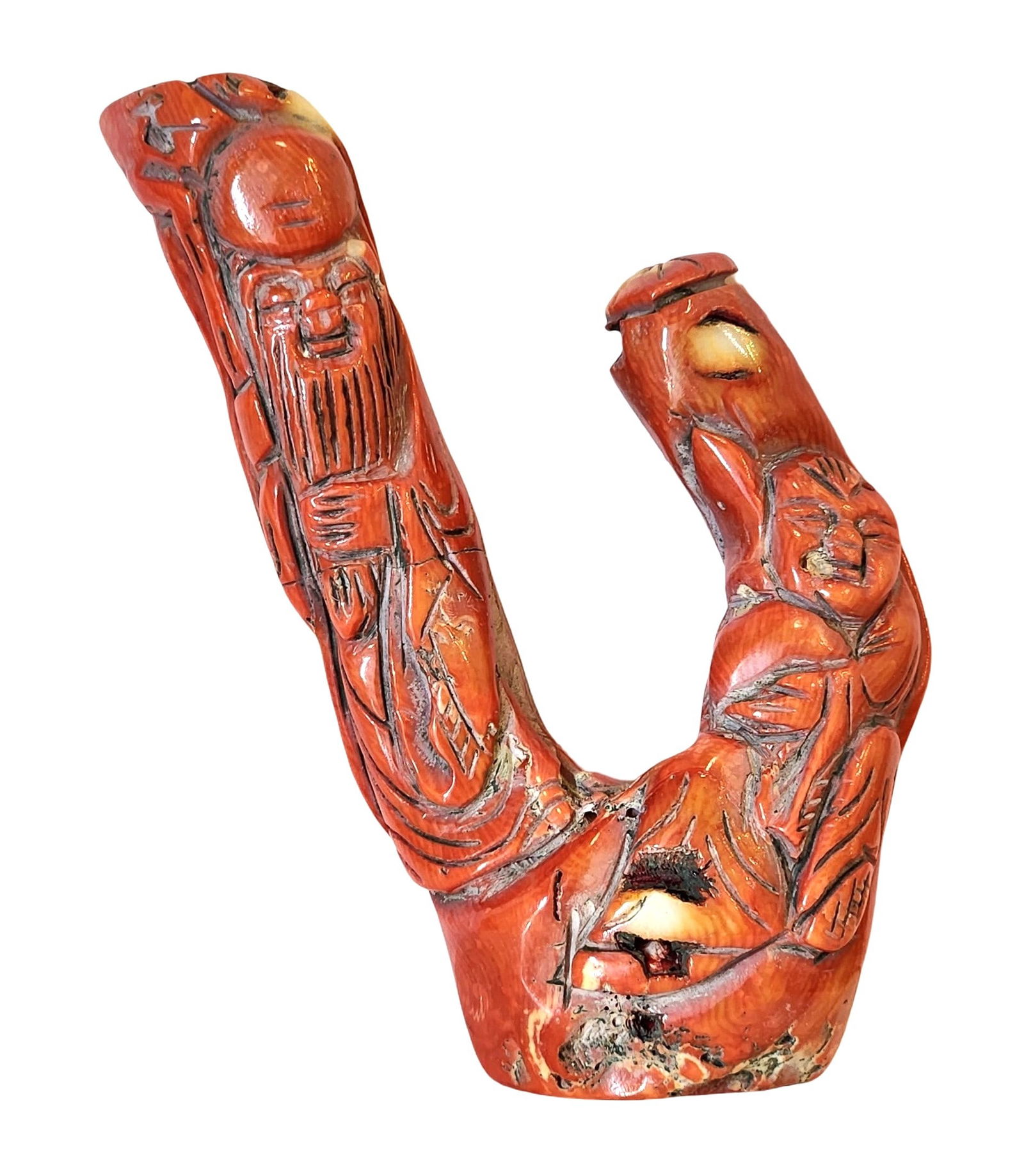 Antique Carved Red Coral Figure of an Immortal, Mid-20th Century: A carved Mediterranean red coral figure, worked from a natural branch and depicting an immortal with flowing robes and detailed facial features. The piece displays organic striations, cavities, and wa