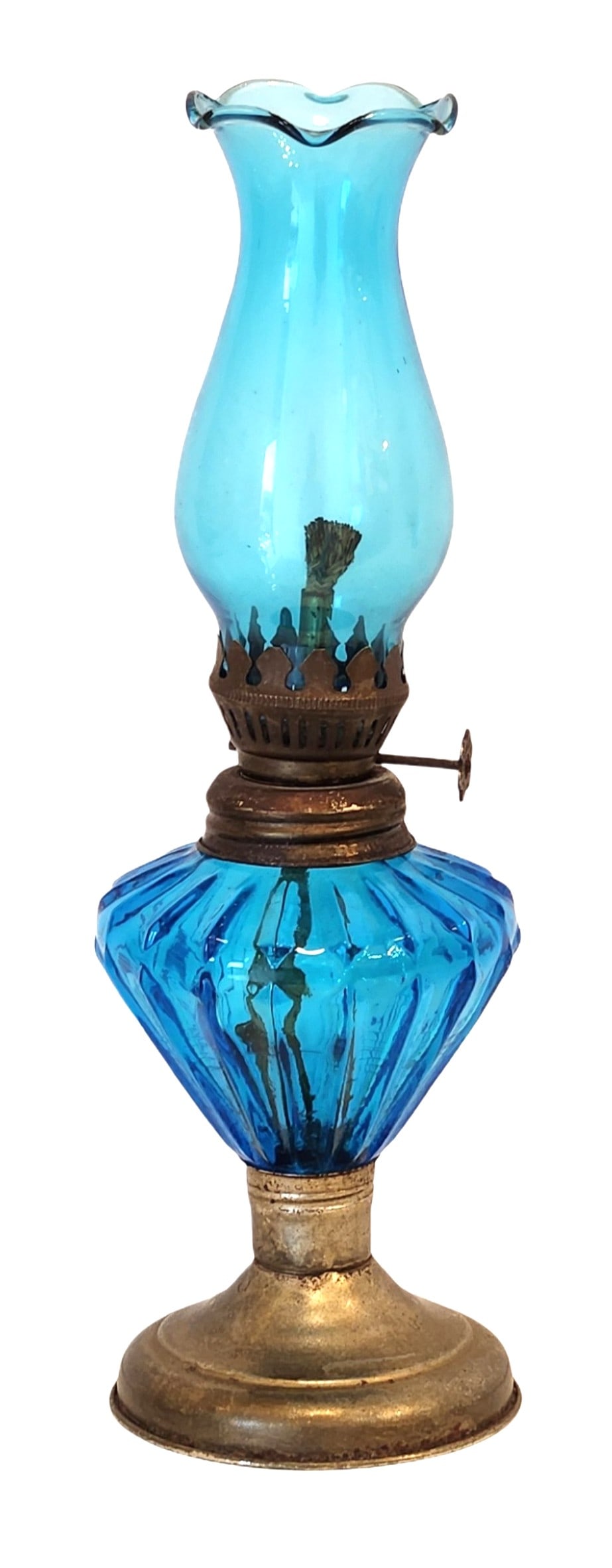 Antique Blue Glass Oil Lamp with Metal Burner and Chimney: Antique blue glass oil lamp featuring a molded glass font with faceted detailing, fitted with a metal burner and a matching blue glass chimney. The lamp retains its original-style flower-form wick