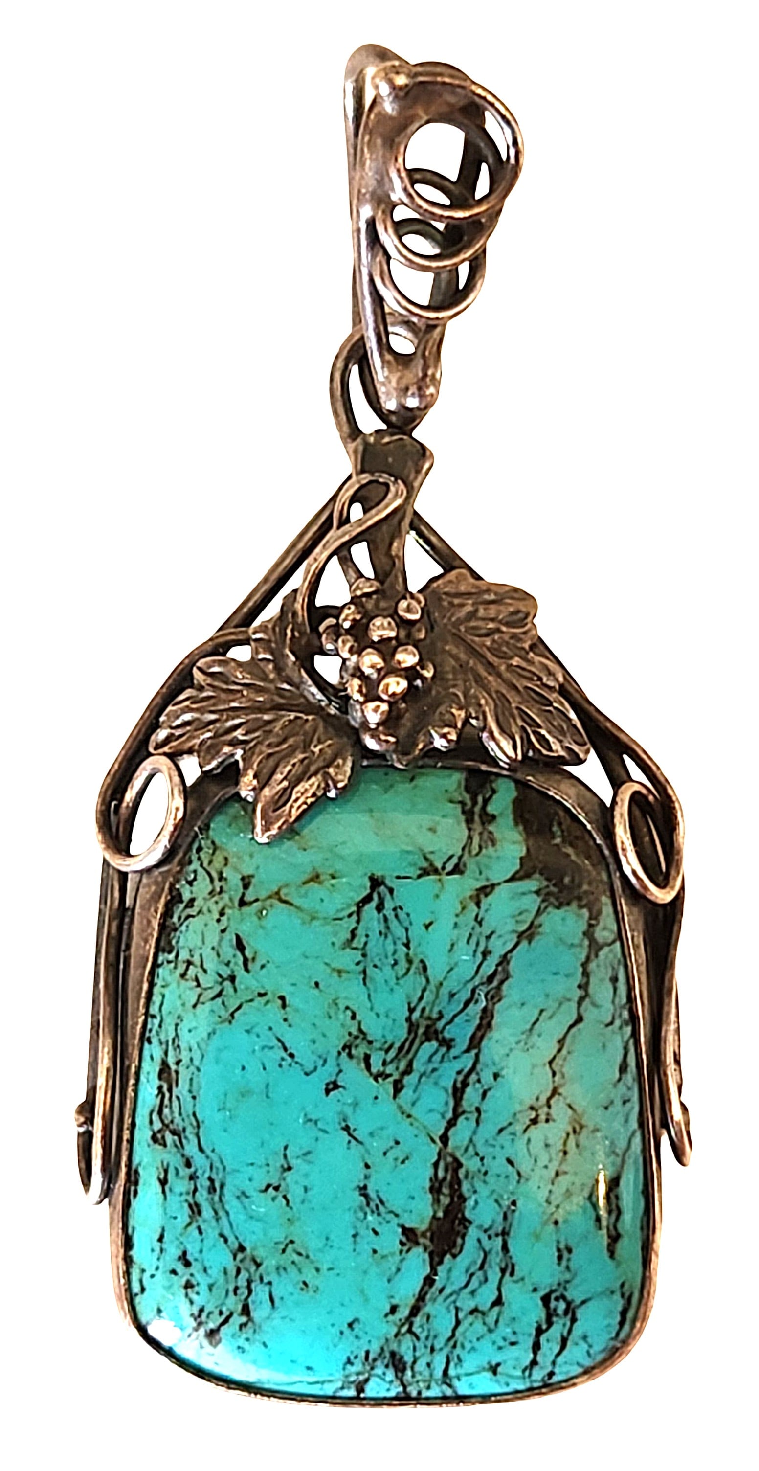 Art Nouveau Style Turquoise Pendant with Grape & Leaf Motif: Decorative turquoise pendant set in an ornate Art Nouveau style metal mount. The pendant features a rectangular turquoise cabochon with prominent dark matrix veining, displaying vibrant blue-green