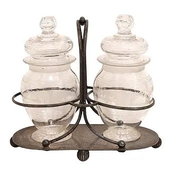 Thomas Otley & Sons Sheffield Silverplate and Glass Jar Set, 19th C.: Antique Sheffield silverplate double jar set by Thomas Otley & Sons, Sheffield, late 19th century. The stand with two etched glass jars and domed lids, held within circular supports on an oval footed