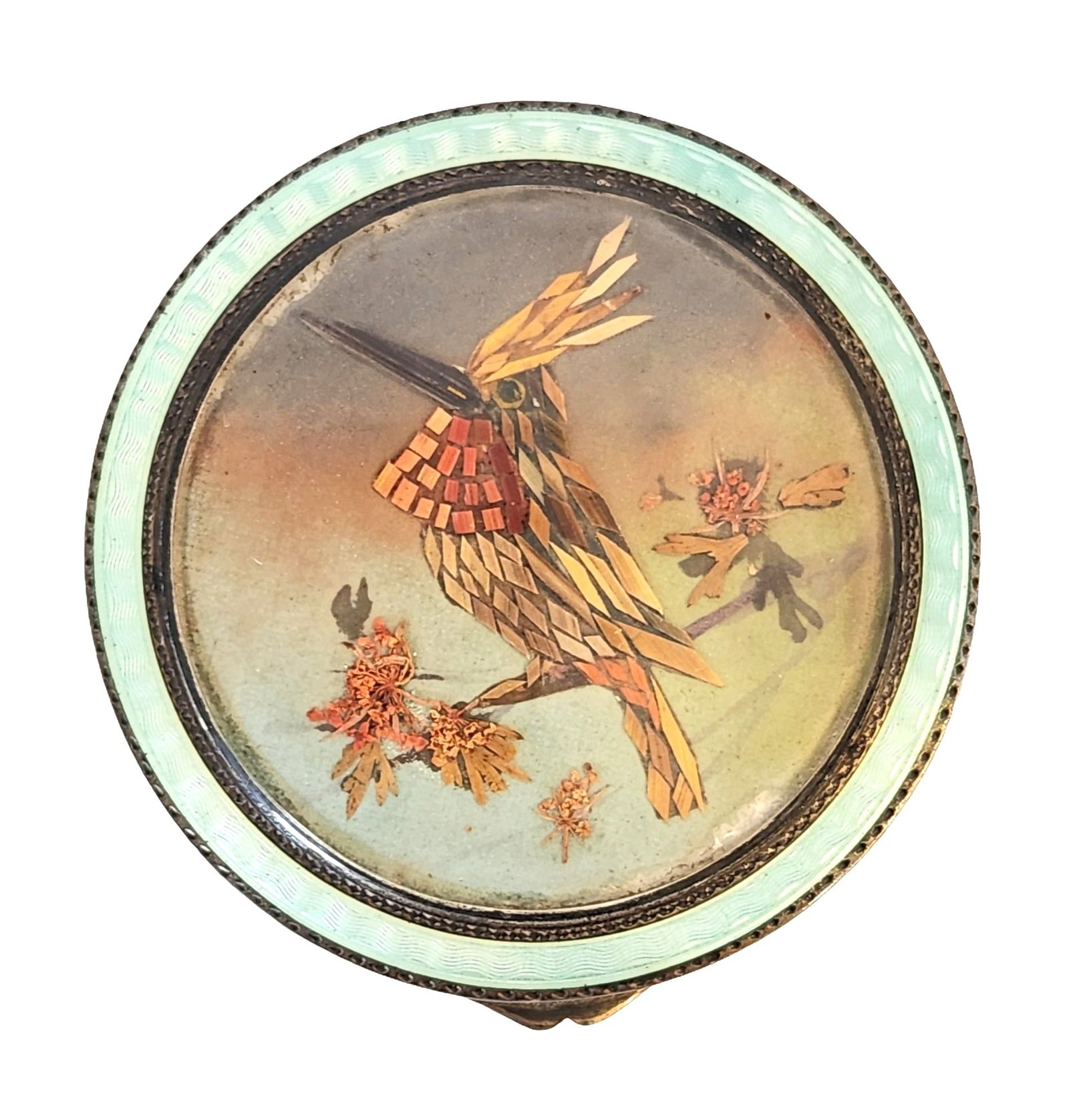 Sterling Silver and Guilloché Enamel Compact with Exotic Bird Inlay: A fine sterling silver compact decorated with translucent green guilloché enamel and an unusual inlaid design of an exotic bird perched among flowers, possibly crafted with feather or wood marquetry.
