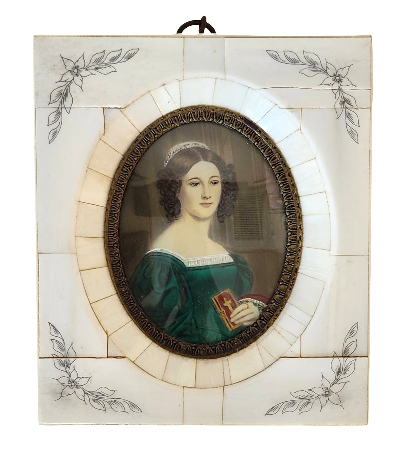 19th-Century Portrait Miniature of Anna Hillmayer, in Inlaid White Frame with Inked Floral: A finely painted 19th-century portrait miniature depicting Anna Hillmayer, shown bust-length wearing a deep green gown and holding a small devotional book adorned with a cross. Her hair is styled in s