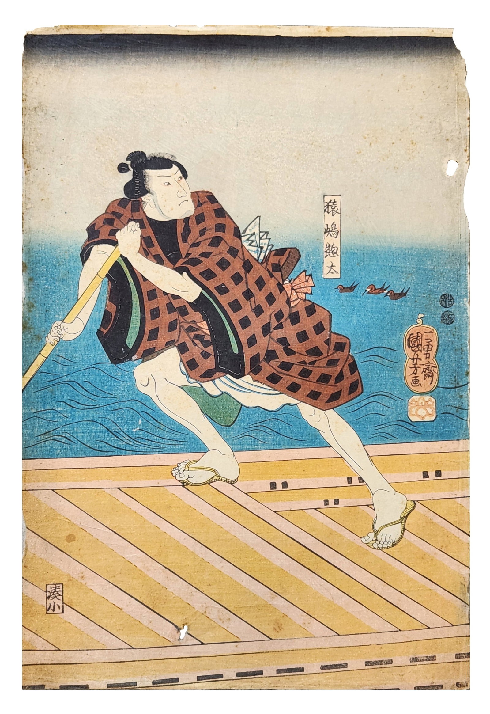 Japanese Ukiyo-e Woodblock Print of Kabuki Actor by Utagawa Kuniyoshi, Edo Period: Japanese ukiyo-e color woodblock print depicting a kabuki actor in a dynamic pose standing on a wooden platform beside a body of water. The figure wears a patterned robe and straw sandals while grippi