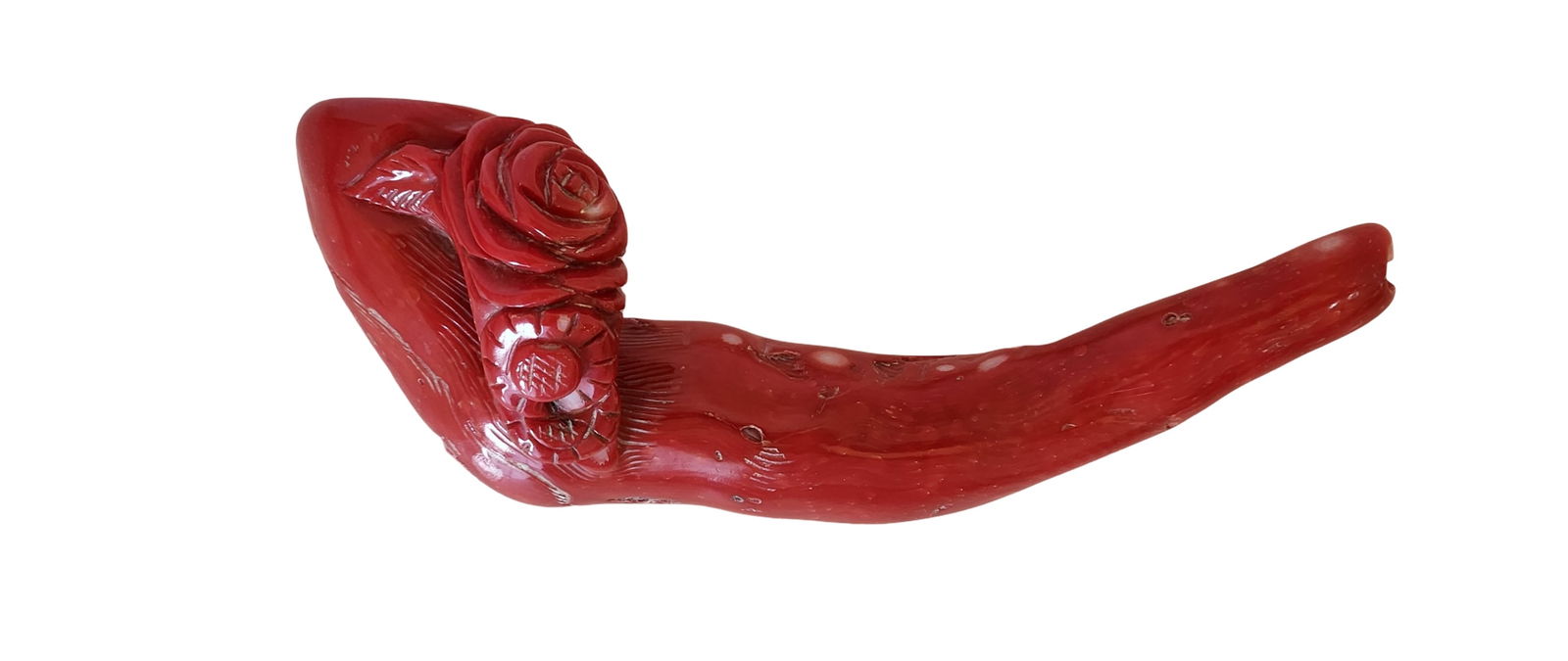 Antique Carved Red Coral Pipe with Rose Decoration, Mid-20th Century: A finely carved Mediterranean red coral pipe, the bowl adorned with a relief of roses symbolizing beauty and longevity. The pipe retains its natural coral branch form, displaying vibrant red tones, or