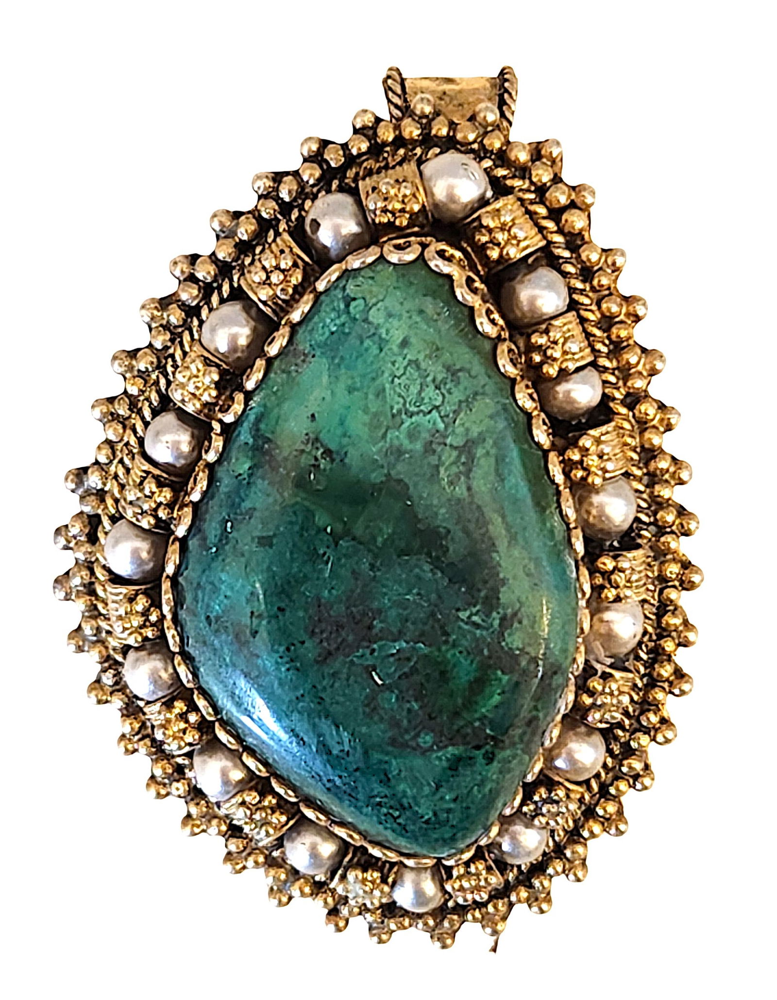Israeli Sterling Silver Pendant/Brooch with Green Stone and Granulation: Sterling silver pendant/brooch featuring a large freeform green cabochon stone, likely chrysocolla or similar material, set within an ornate granulated silver frame accented with raised beadwork and d