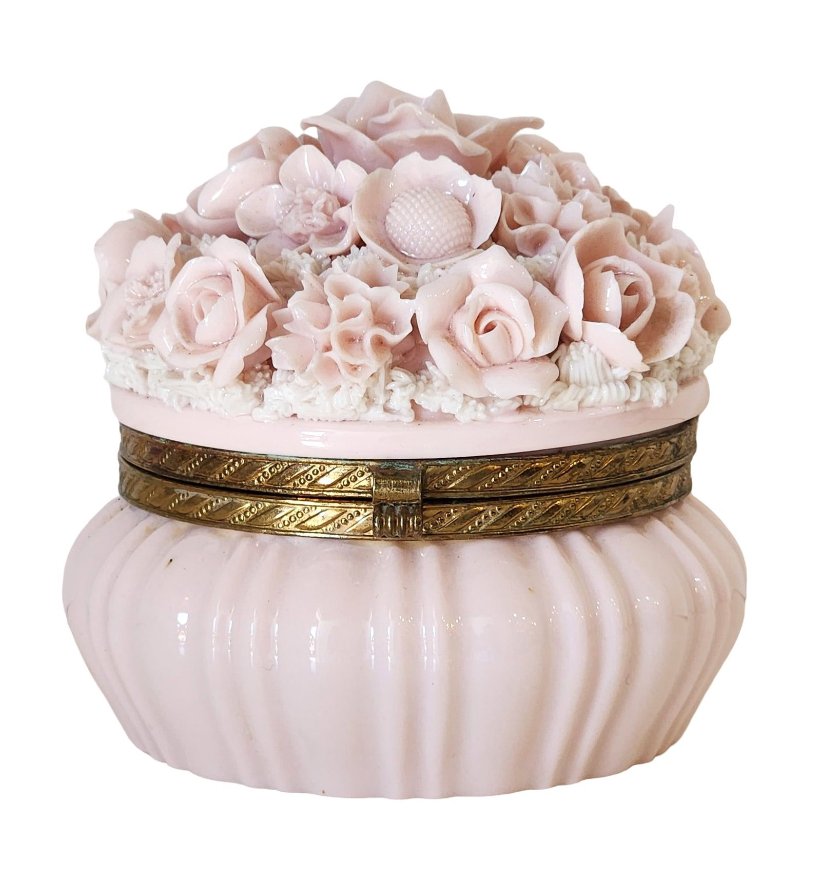 Vintage Pink Porcelain Floral Trinket Box with Gilt Metal Mount: A beautifully crafted vintage trinket box in soft pink porcelain, adorned with a lavish bouquet of delicate hand-formed roses, flowers, and textured foliage on the lid. The ornate floral decoration is