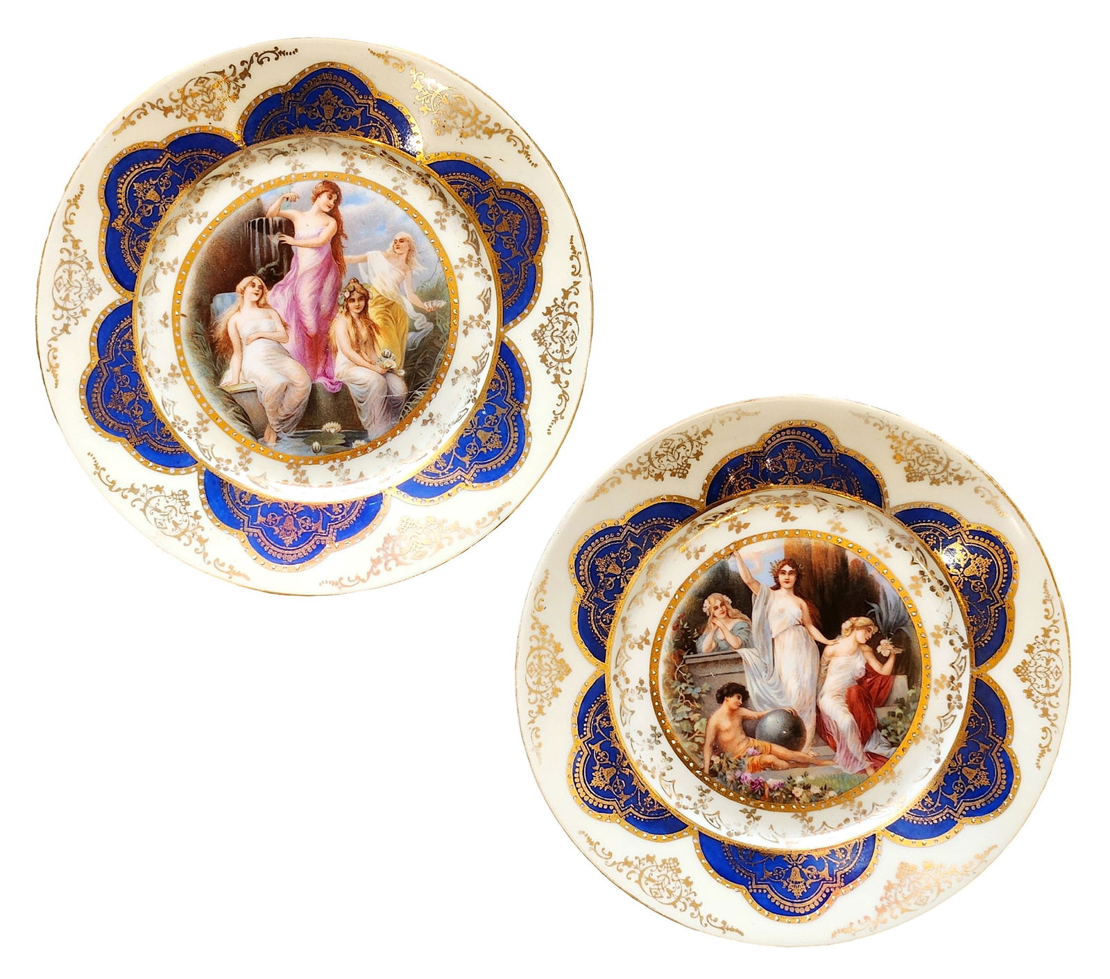 Pair of Victoria Czechoslovakia Porcelain Cabinet Plates with Classical Figural Scenes: A decorative pair of fine porcelain cabinet plates by Victoria, Czechoslovakia, featuring richly detailed classical figural scenes at the center. Each plate depicts elegant women in Greco-Roman style