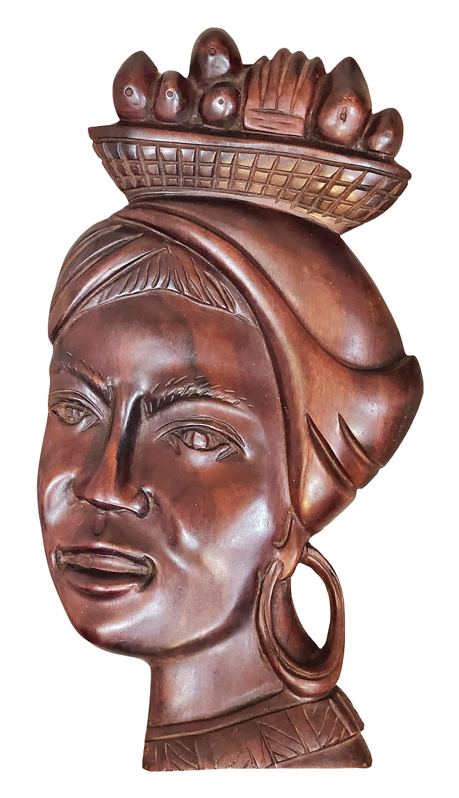 Vintage Carved Wooden Woman’s Head Wall Plaque: Vintage hand-carved wooden wall plaque depicting a stylized woman’s head in profile. The figure wears large hoop earrings and a headpiece topped with a basket of fruit, rendered in relief carving. T