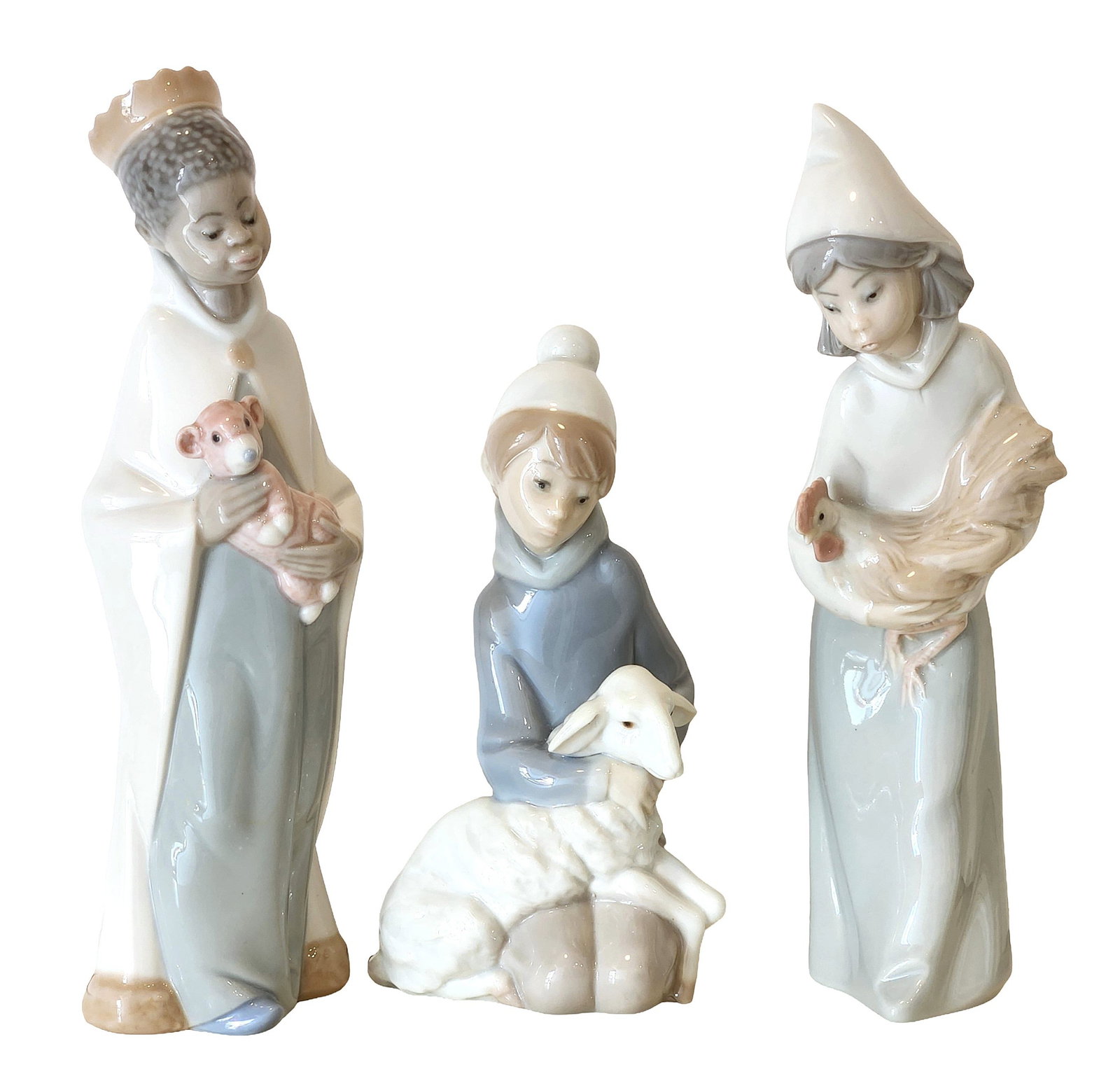 Lladro Nativity Shepherd Children Figurines – Set of 3 – Lamb, Chicken & Pig – Spain: Beautiful set of three Lladro porcelain figurines depicting young shepherd children, each gently holding an animal—perfect for a nativity scene or as standalone decorative pieces. Measure 6"in H x 2