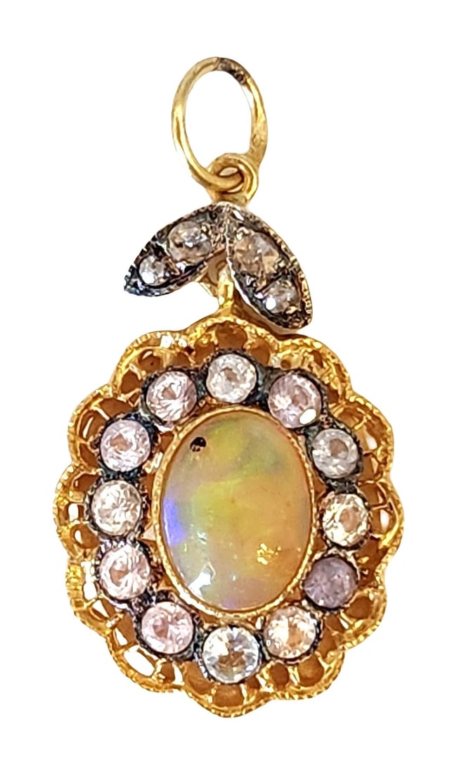 Silver Gilt Pendant with Opal, White Sapphires, and Rose-Cut Diamonds: Charming oval pendant finely crafted in gilt sterling silver (.925), centered by a luminous opal exhibiting vivid flashes of green, blue, and orange. The gemstone is framed by a halo of brilliant whit