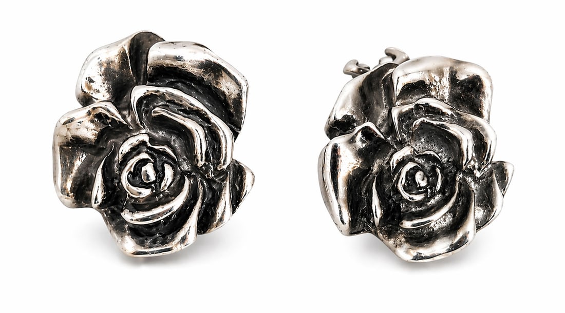 Tiffany & Co. Style Sterling Silver Rose Clip-On Earrings, Marked T&CO 925: Pair of vintage sterling silver earrings featuring a sculpted rose motif in high-relief. The earrings include both clip-on backs and posts for added security. Marked “T&CO 925” on the reverse,