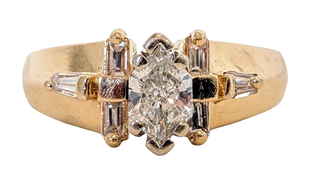 14K Yellow Gold Natural Diamond Ring Marquise Center 0.50 CT: Elegant 14K yellow gold ring featuring a stunning marquise-cut natural diamond center stone, approximately 0.50 carats. The center diamond is accented by a combination of baguette and tapered diamonds