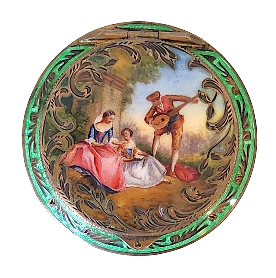 Austrian Sterling Silver and Enamel Compact with Romantic Scene, ca. Early 20th Century: Exquisite Austrian sterling silver and enamel compact, decorated with a finely painted romantic pastoral scene of two ladies and a gentleman musician in 18th-century attire. The border is adorned with