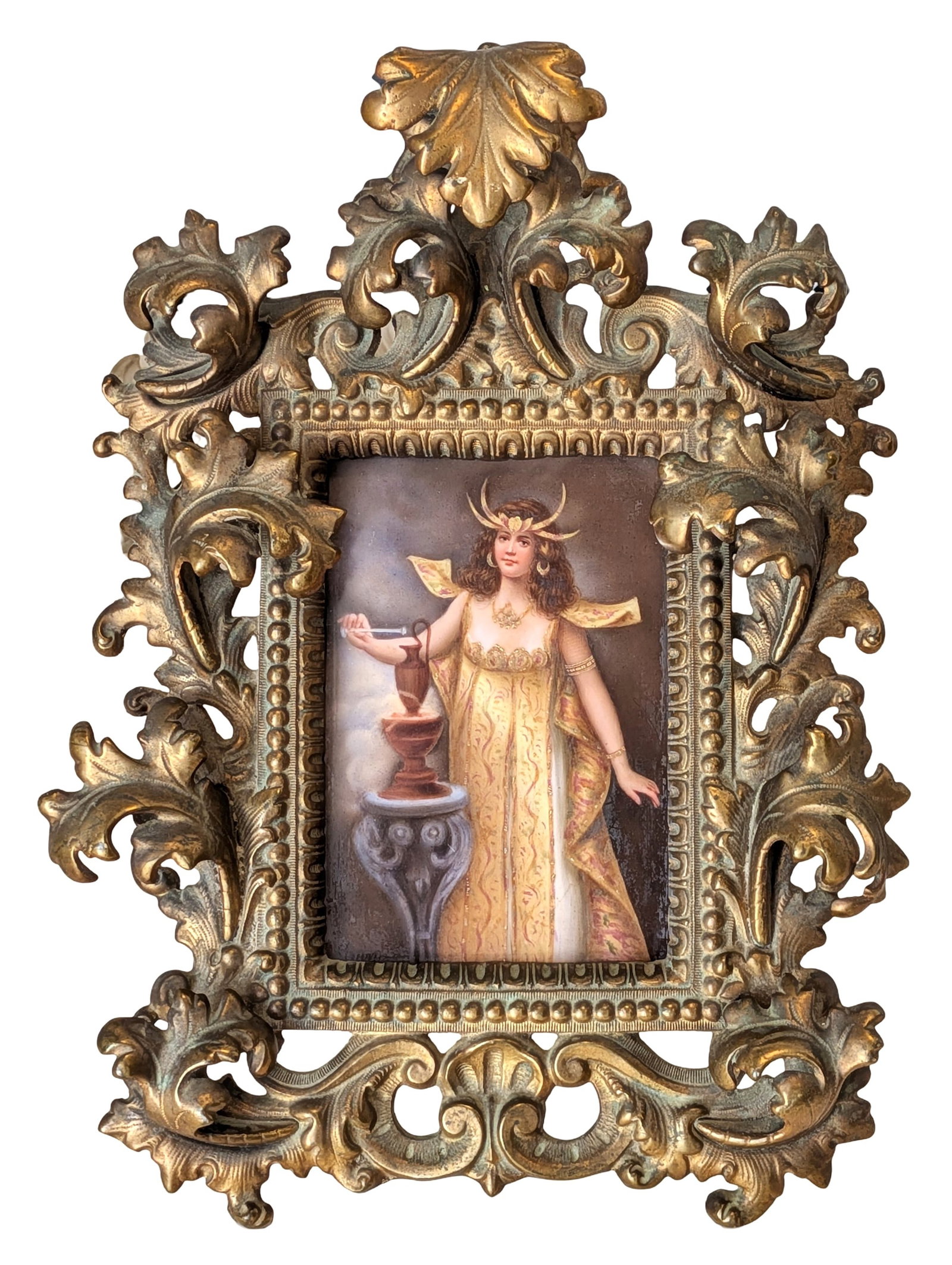 Art Nouveau Style Hand-Painted Porcelain Plaque in Ornate Gilt Bronze Frame: Decorative Art Nouveau style hand-painted porcelain plaque depicting an elegant female figure in flowing classical attire beside a pedestal urn. The woman wears a crescent headdress and jeweled adornm