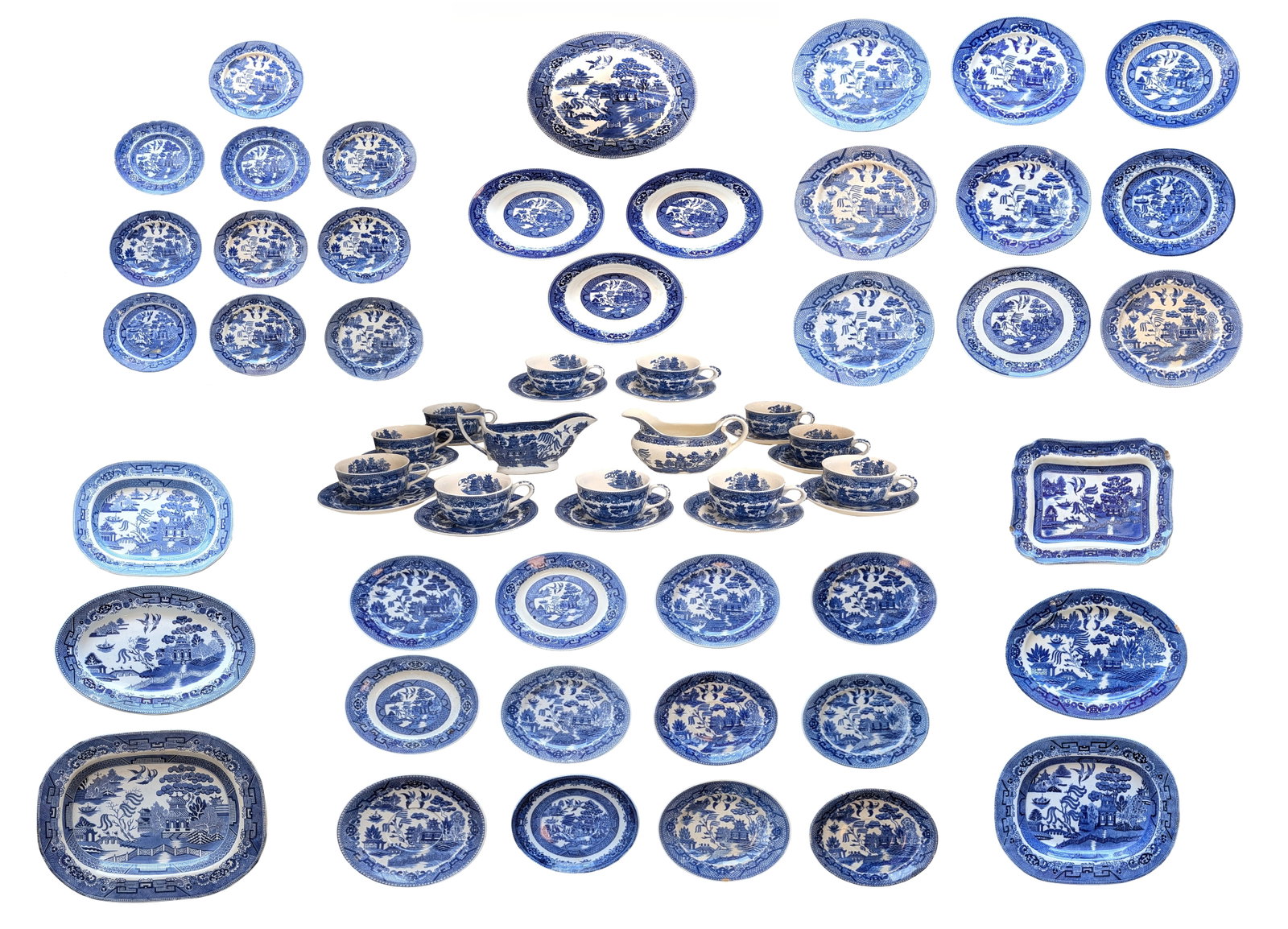 Large Mixed Blue Willow Transferware China Collection ? England & Japan ? Cups, Saucers, Plates &: Extensive mixed collection of blue and white transferware in the classic Blue Willow pattern, including pieces marked England, Japan, and Made in Japan. The lot features a wide assortment of tableware