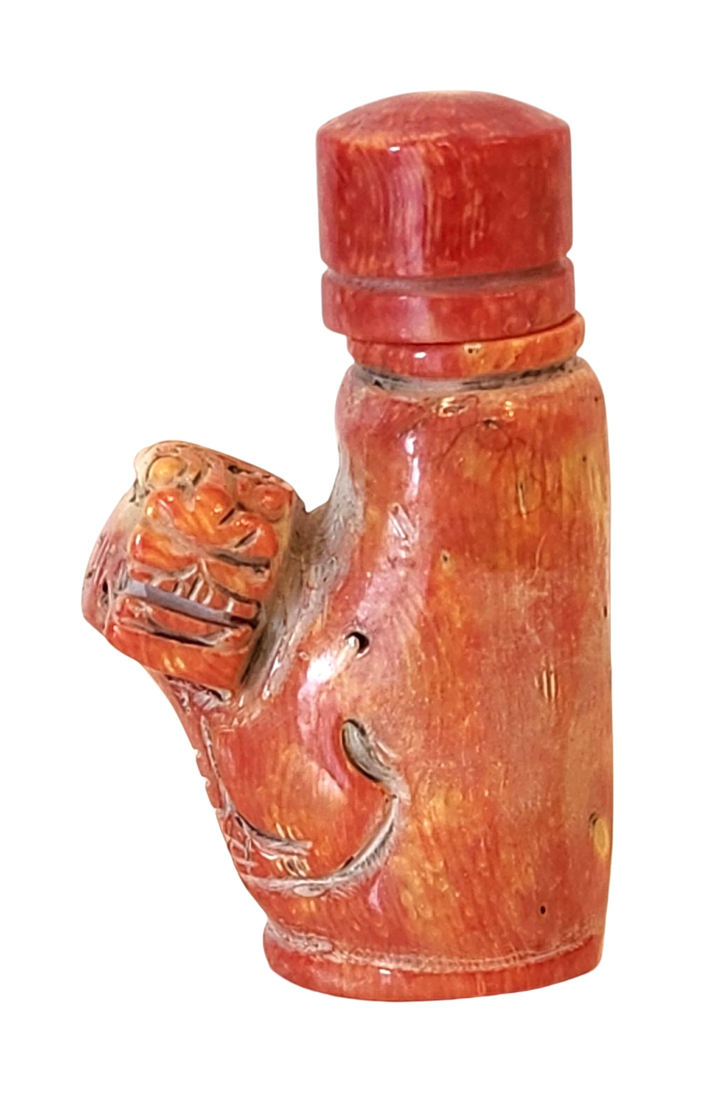 Antique Carved Red Coral Snuff Bottle with Tiger Motif, Mid-20th Century: A carved Mediterranean red coral snuff bottle featuring a tiger motif in relief, symbolizing courage and strength. The piece retains its coral stopper with original spoon. The natural striations, incl